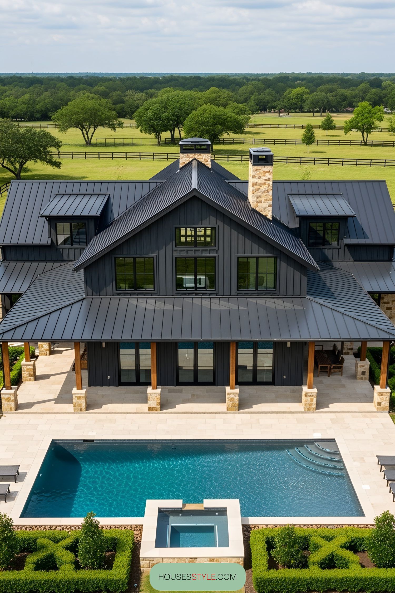 Barndominium with pool and wraparound porch