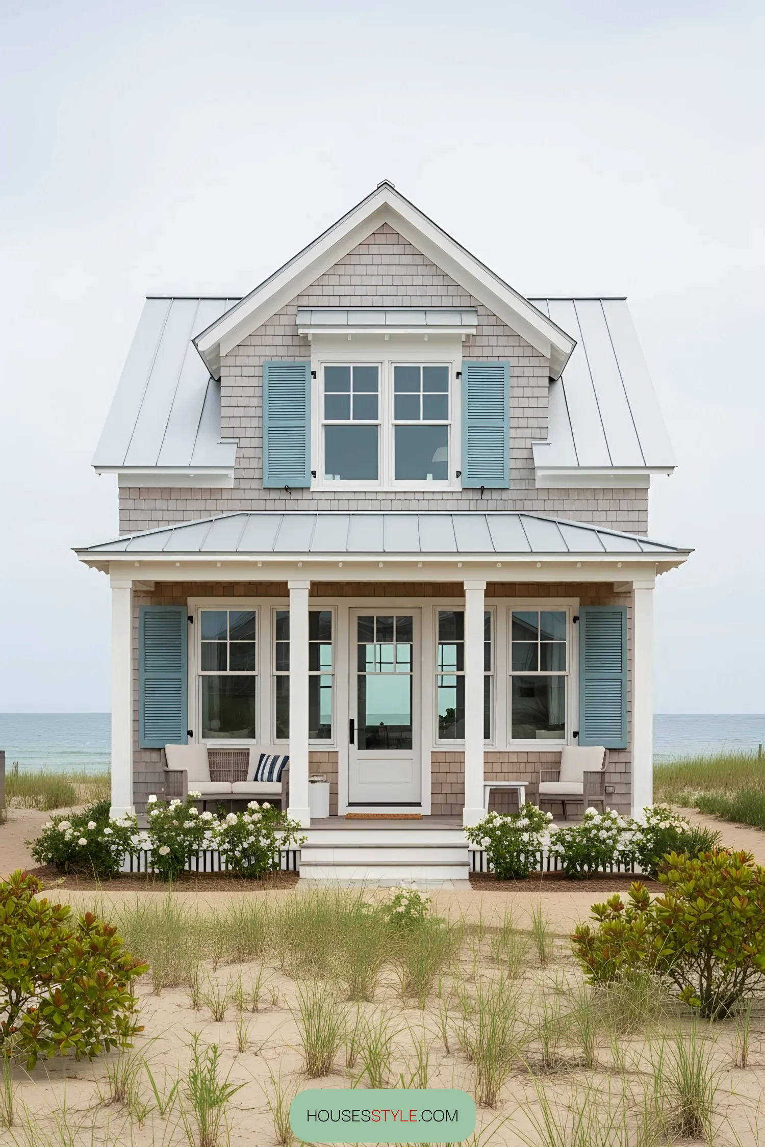 Coastal house with blue shutters and porch