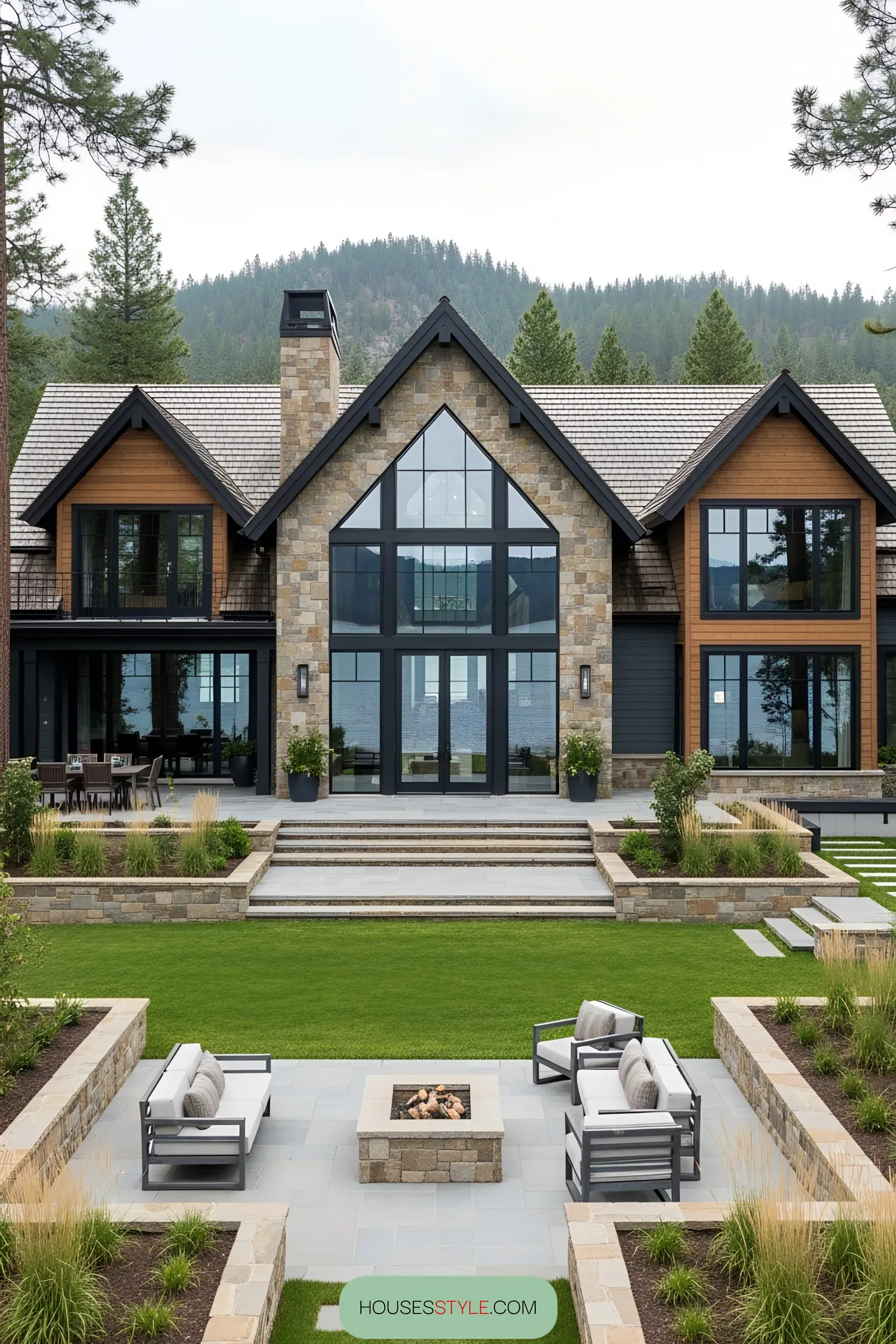 Luxury lake house with large windows and lush landscaping