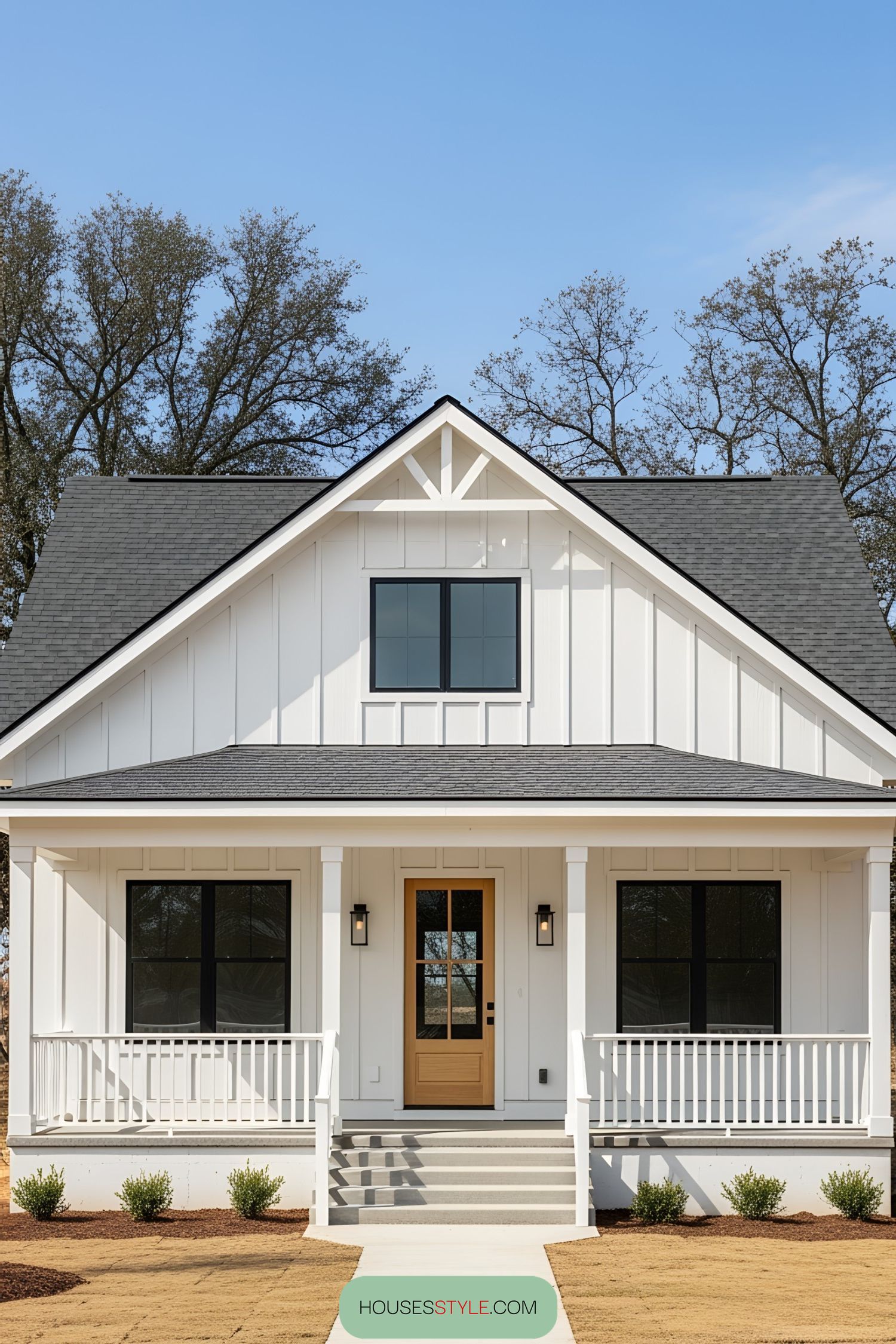 White bungalow with a gabled roof and a welcoming porch