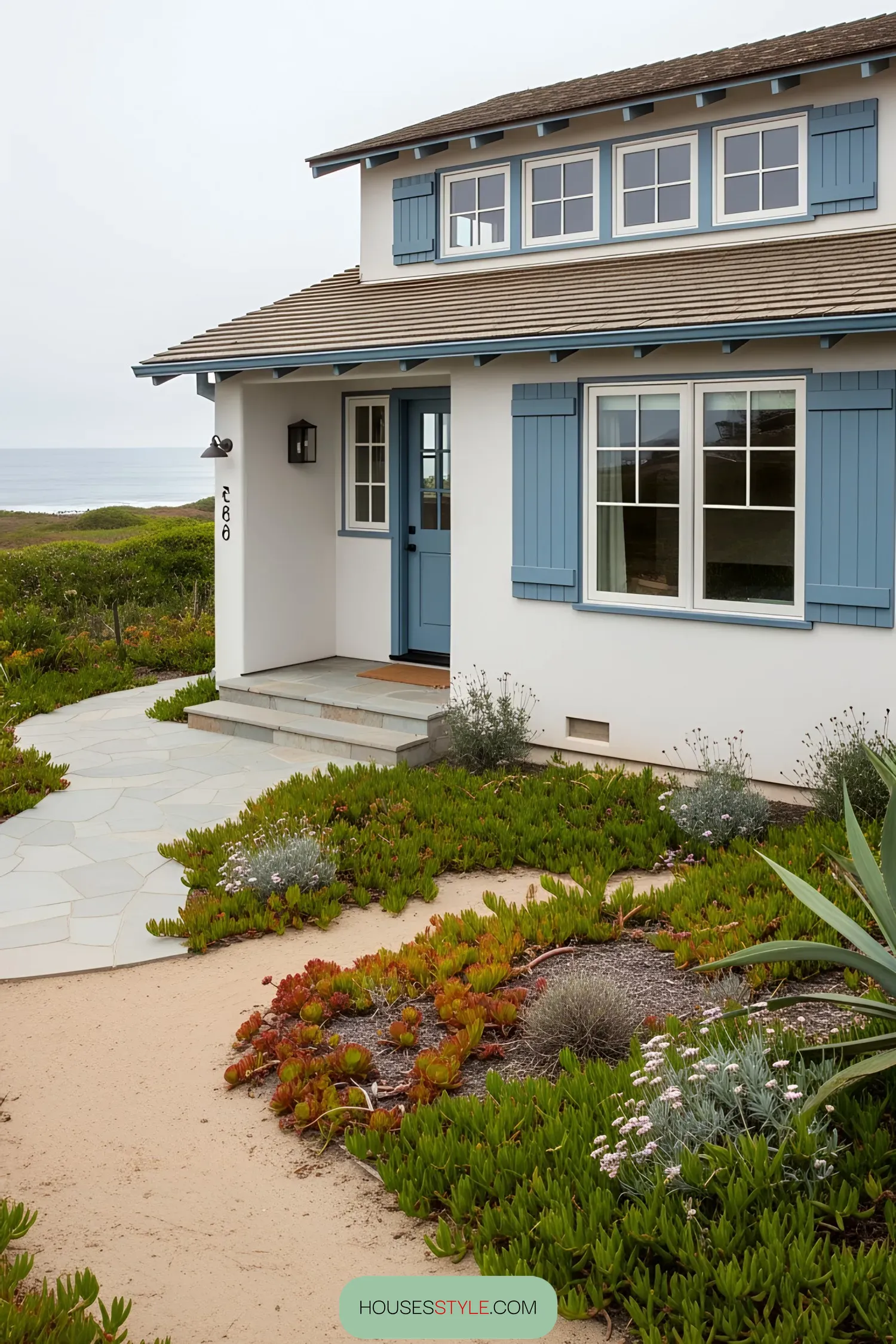 Coastal house with blue accents and ocean view