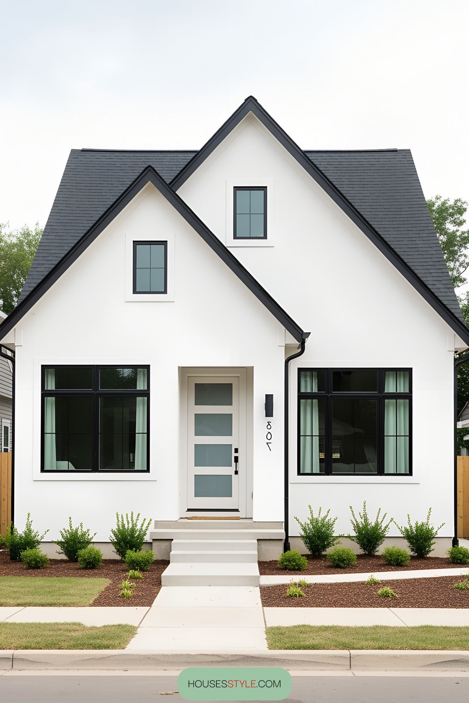 Charming white bungalow with black accents