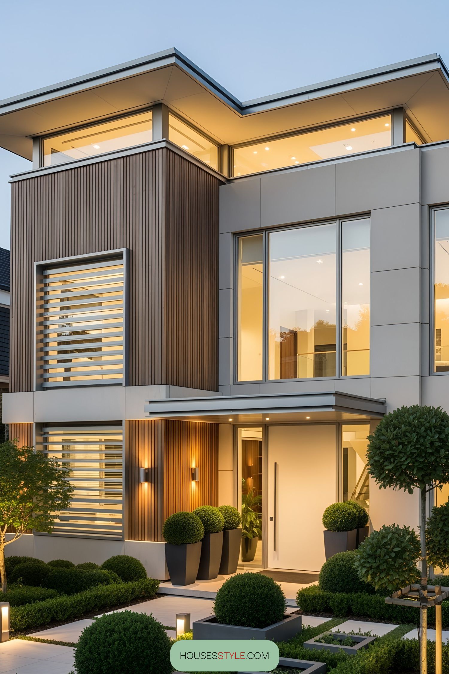 Modern luxury villa with sleek design, large windows, and lush greenery