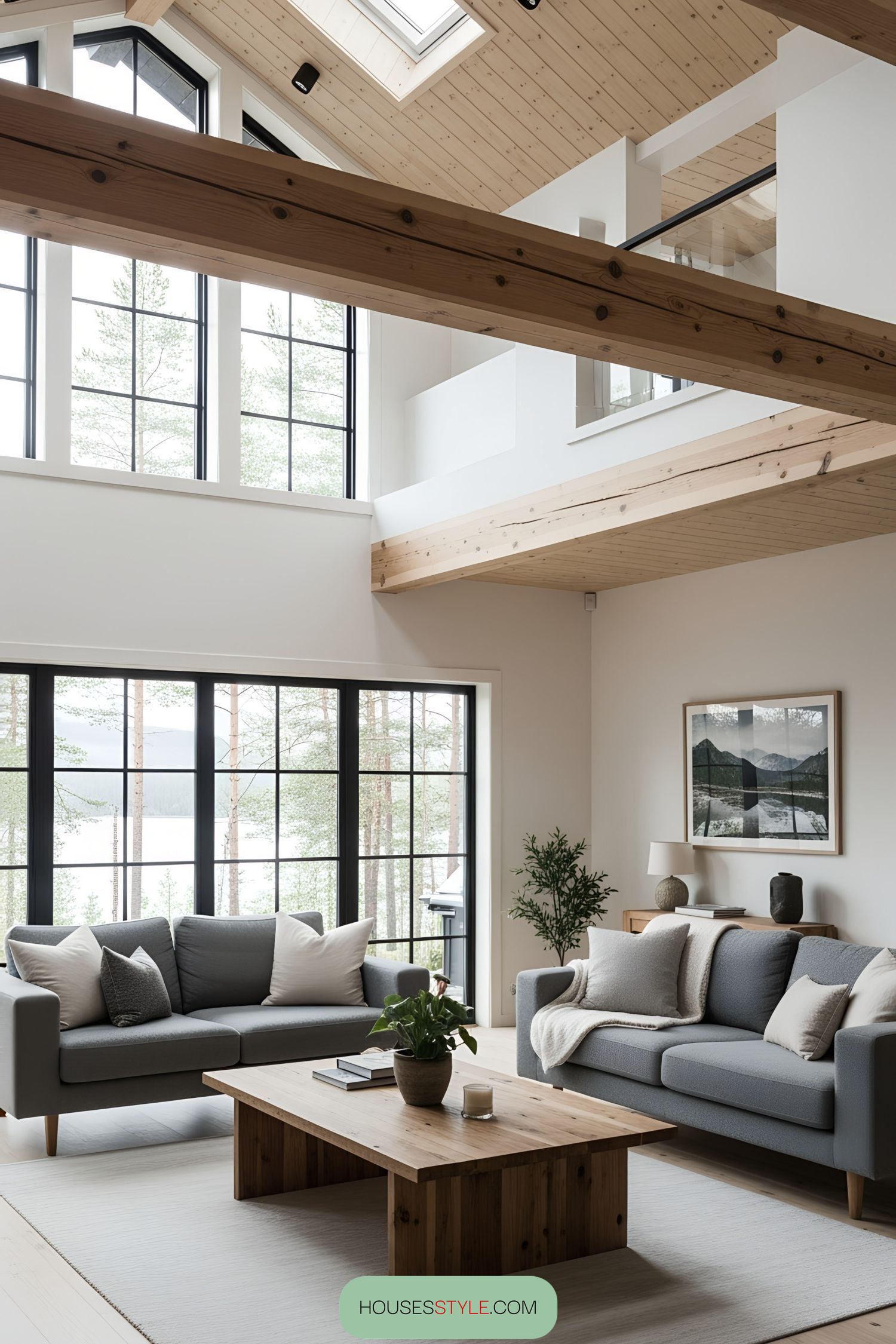 Spacious living room with large windows and wood accents