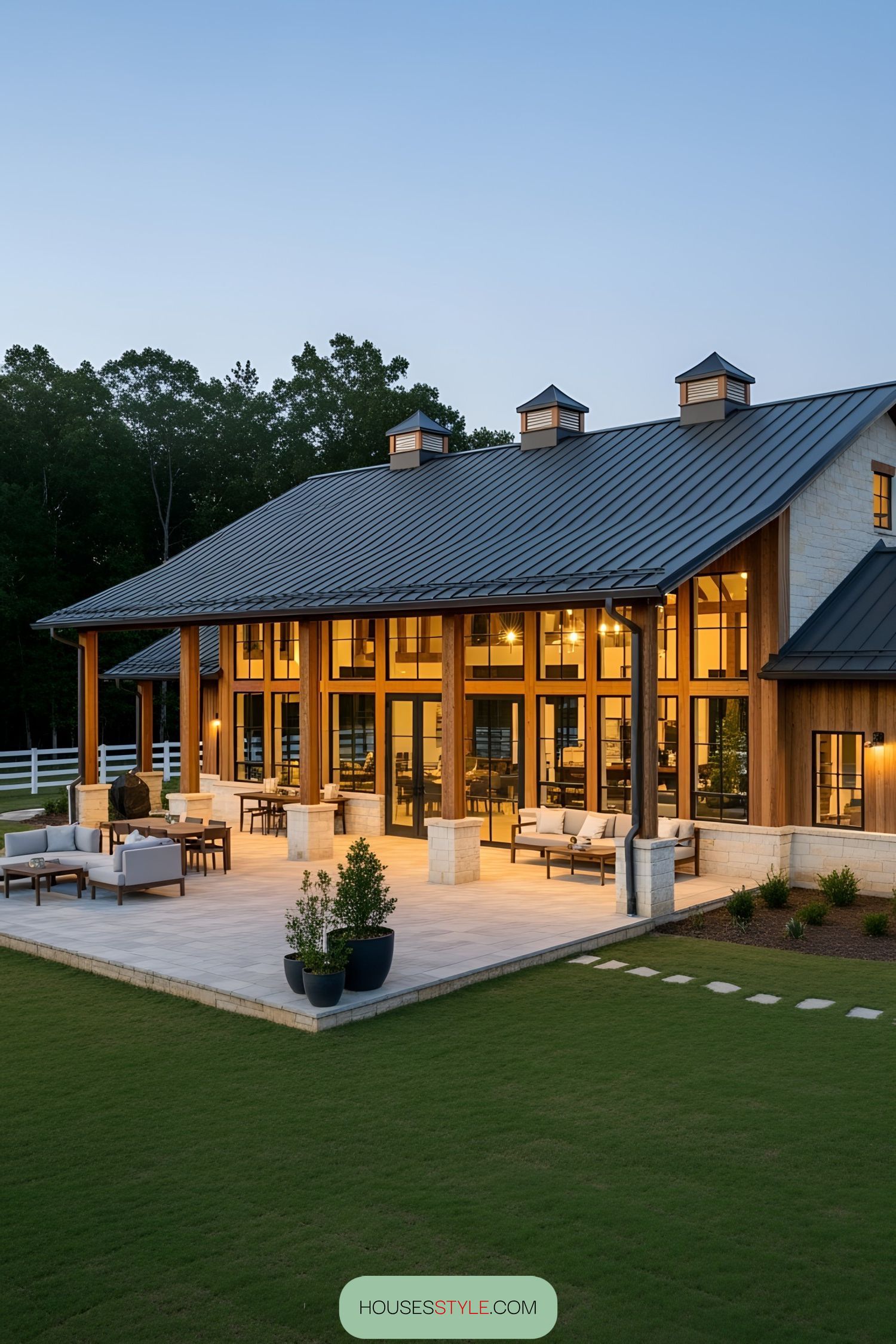Expansive barndominium with a welcoming wraparound porch