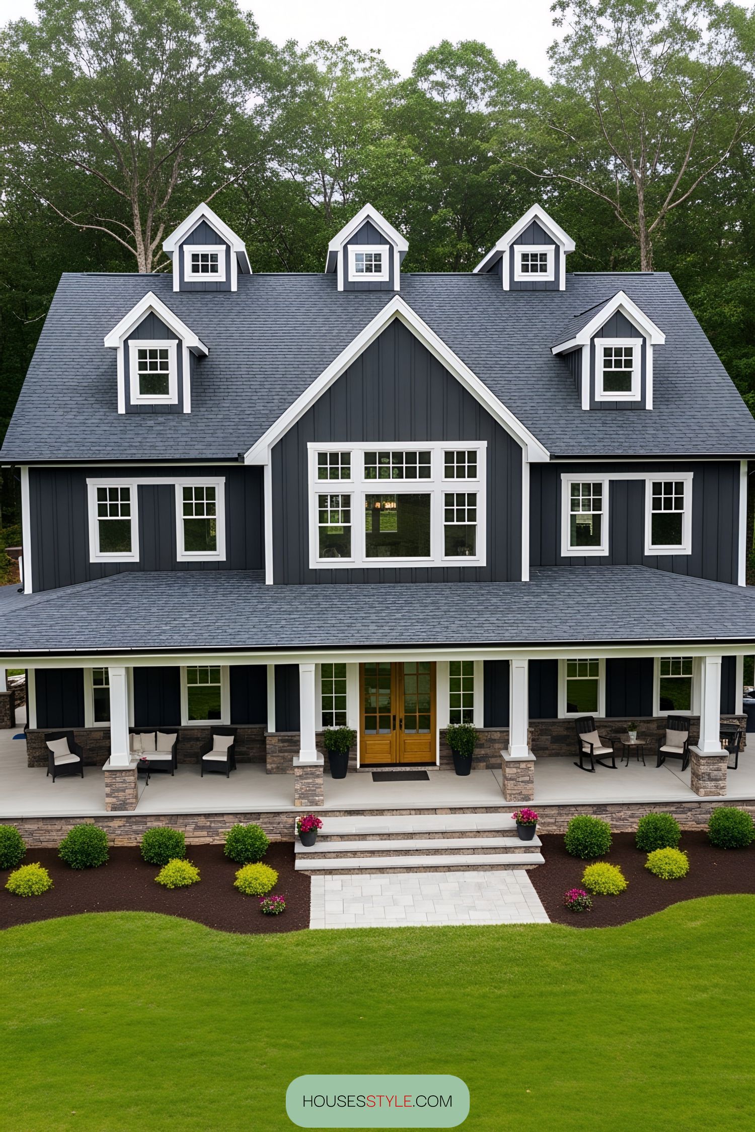 Cozy barnhouse with wraparound porch and lush landscape