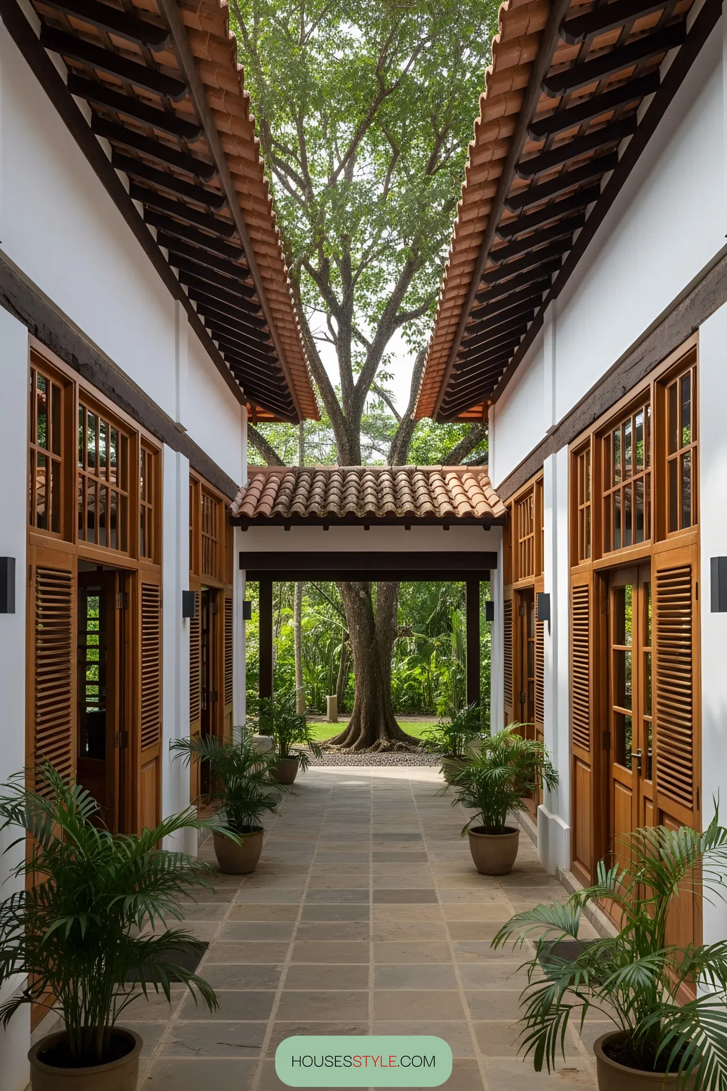 Colonial-style courtyard framed by lush trees