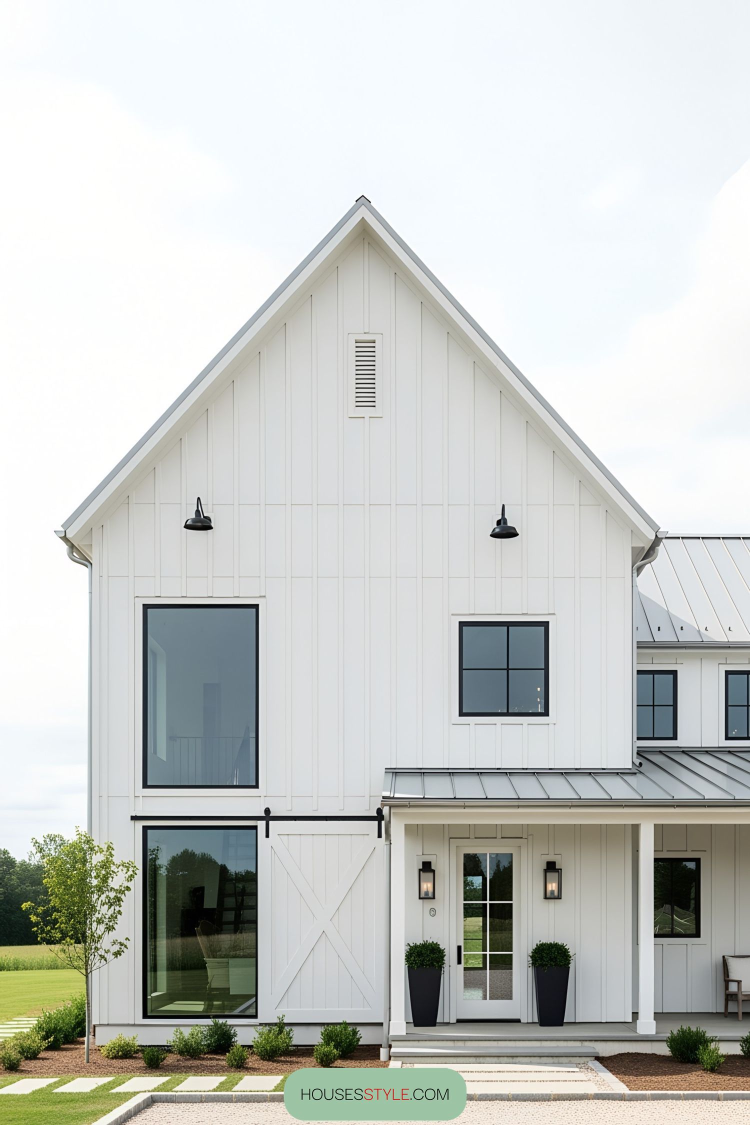 Modern white barn house with large windows