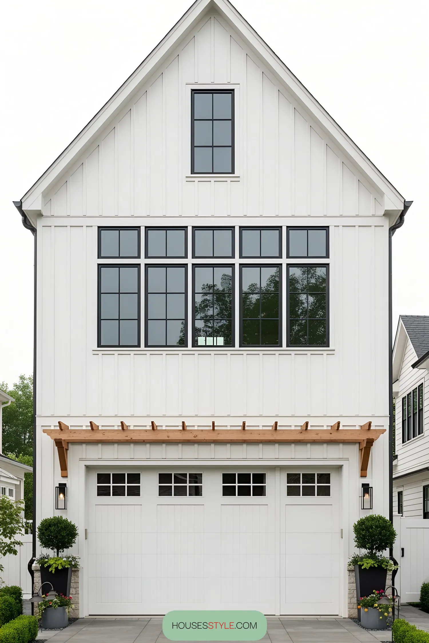 Bright white farmhouse with attached garage