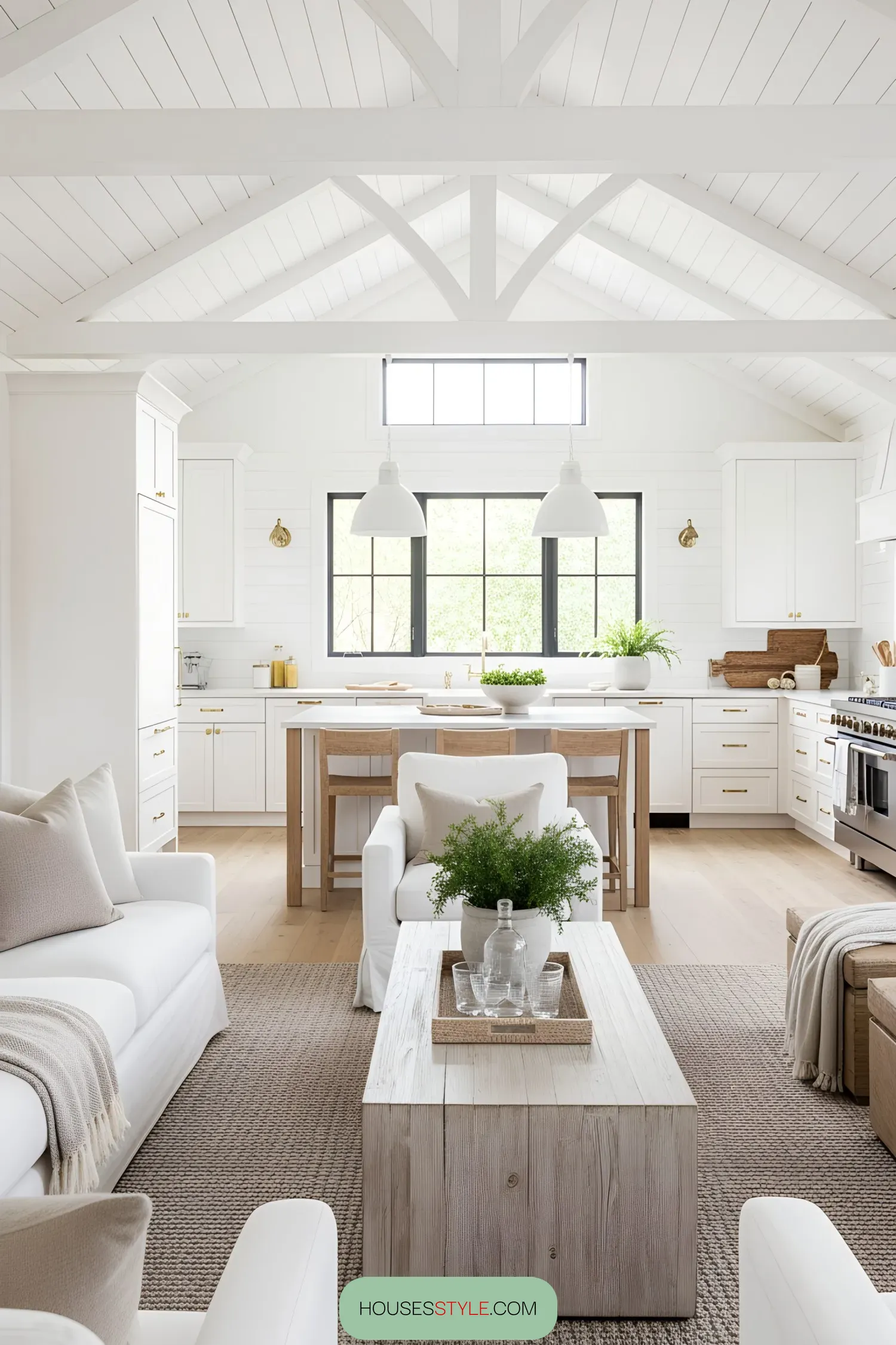 Bright and airy modern beach house living room with white and natural wood elements