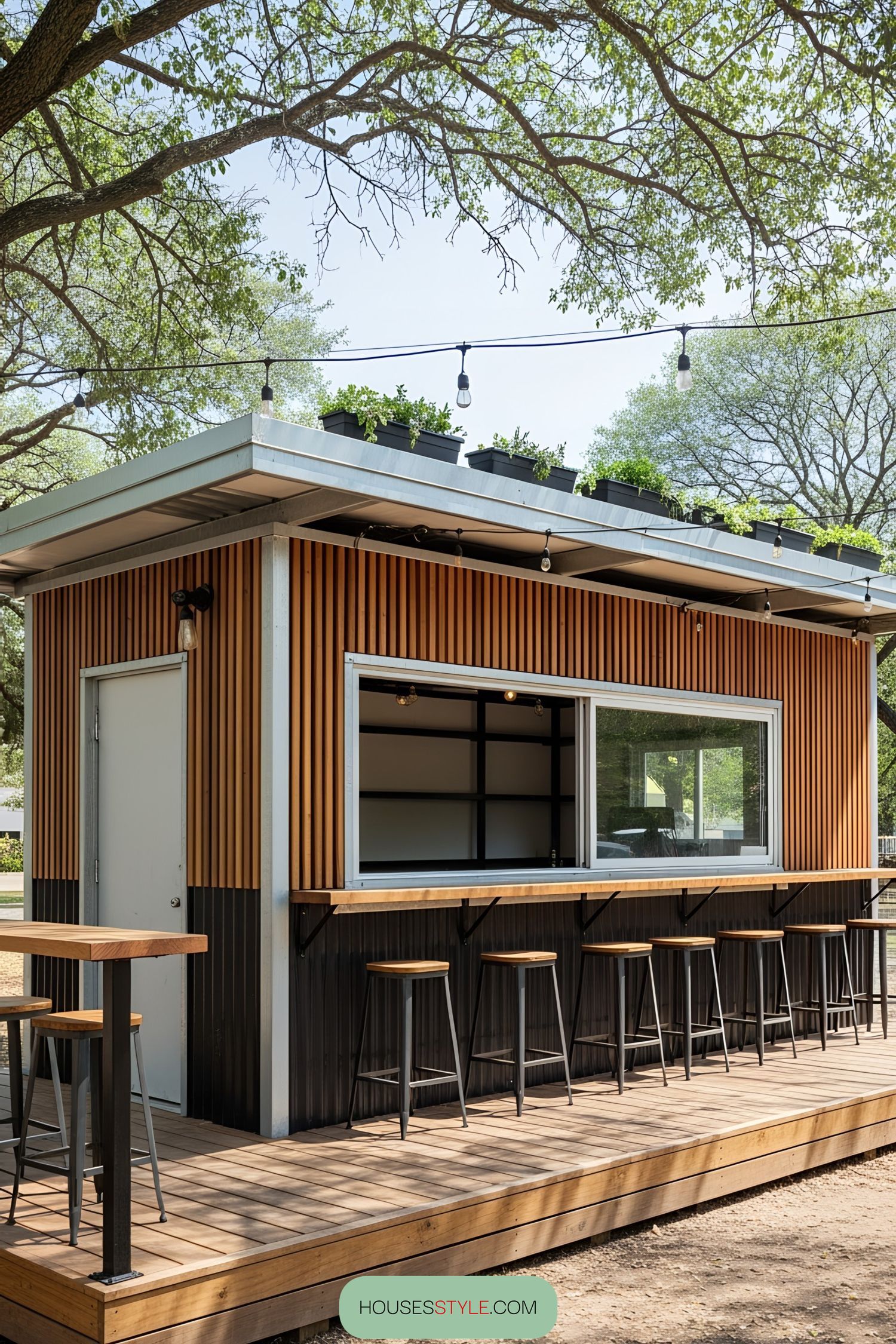 Compact bar made from a shipping container with seating and a rooftop garden