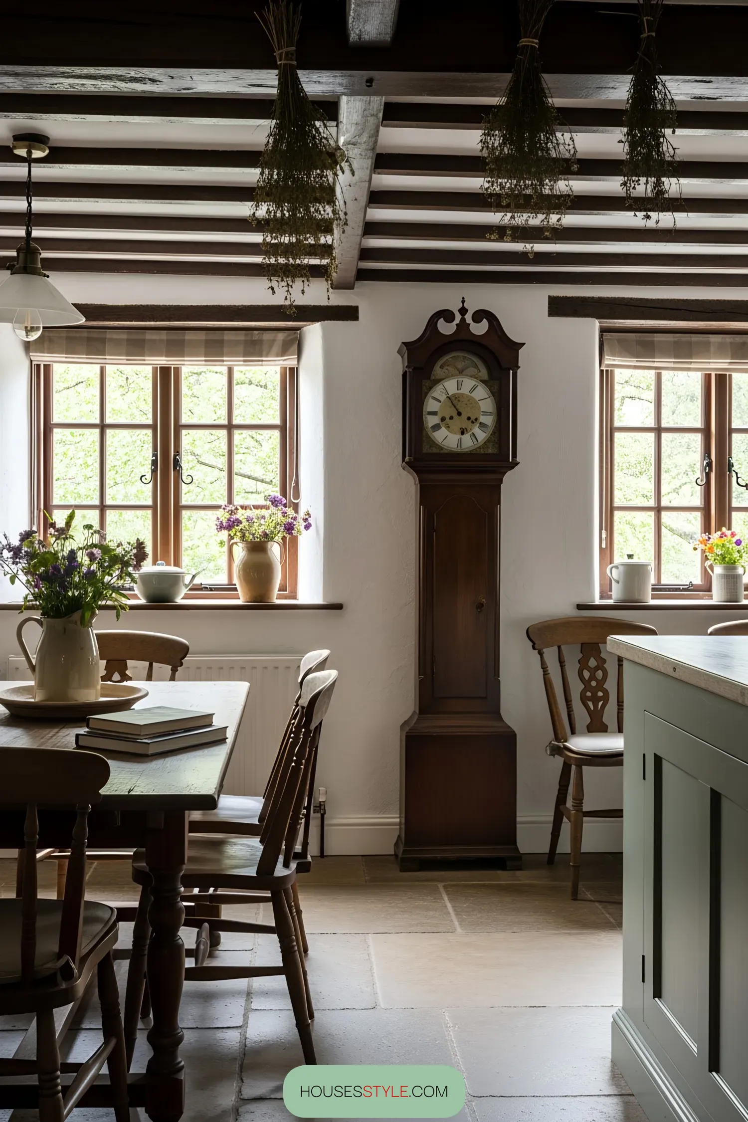 Grandfather clock beside wooden table in cozy cottage kitchen