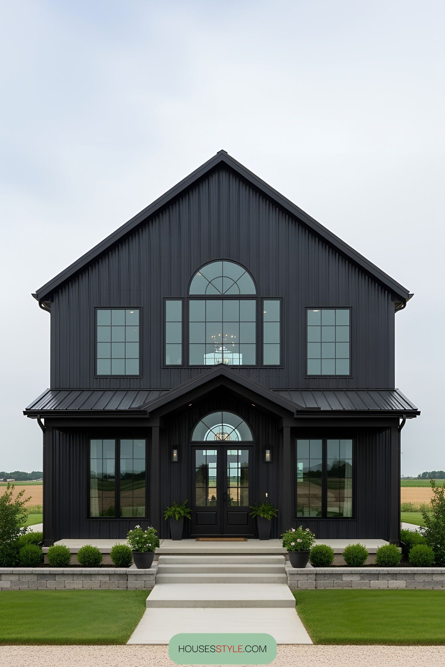 Sleek black barn-style house with large windows