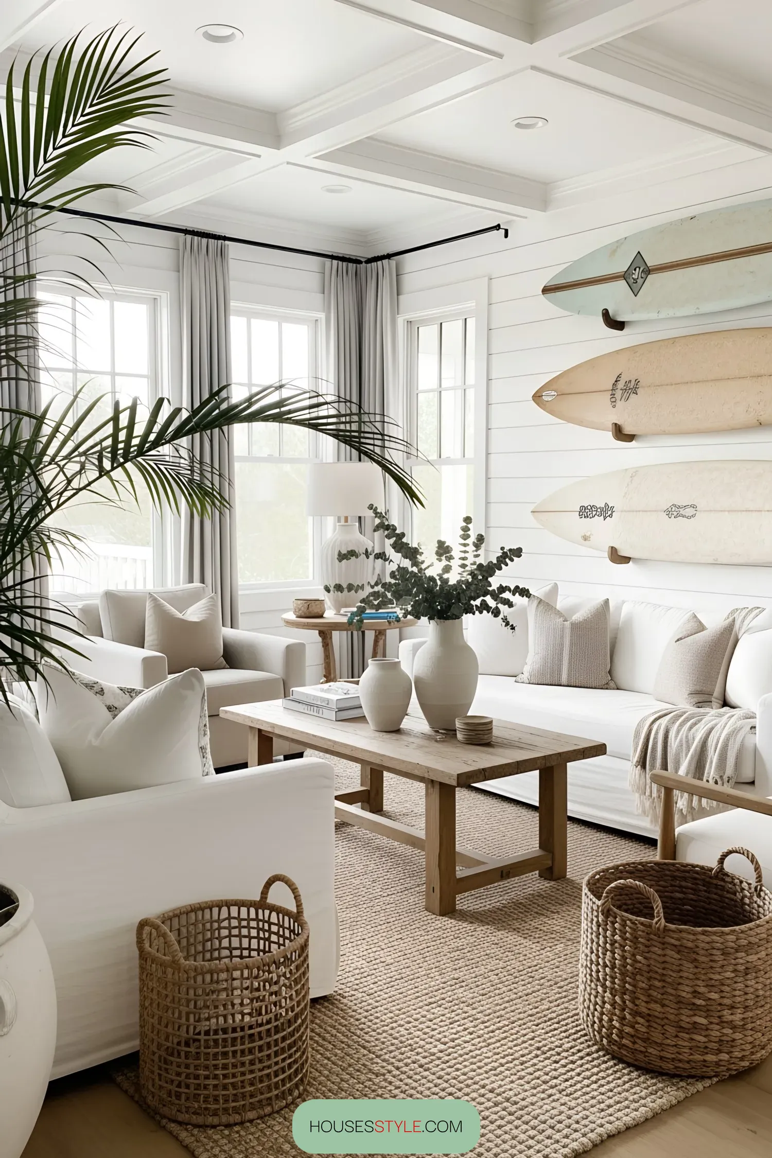 Cozy beach living room with surfboards and white furniture