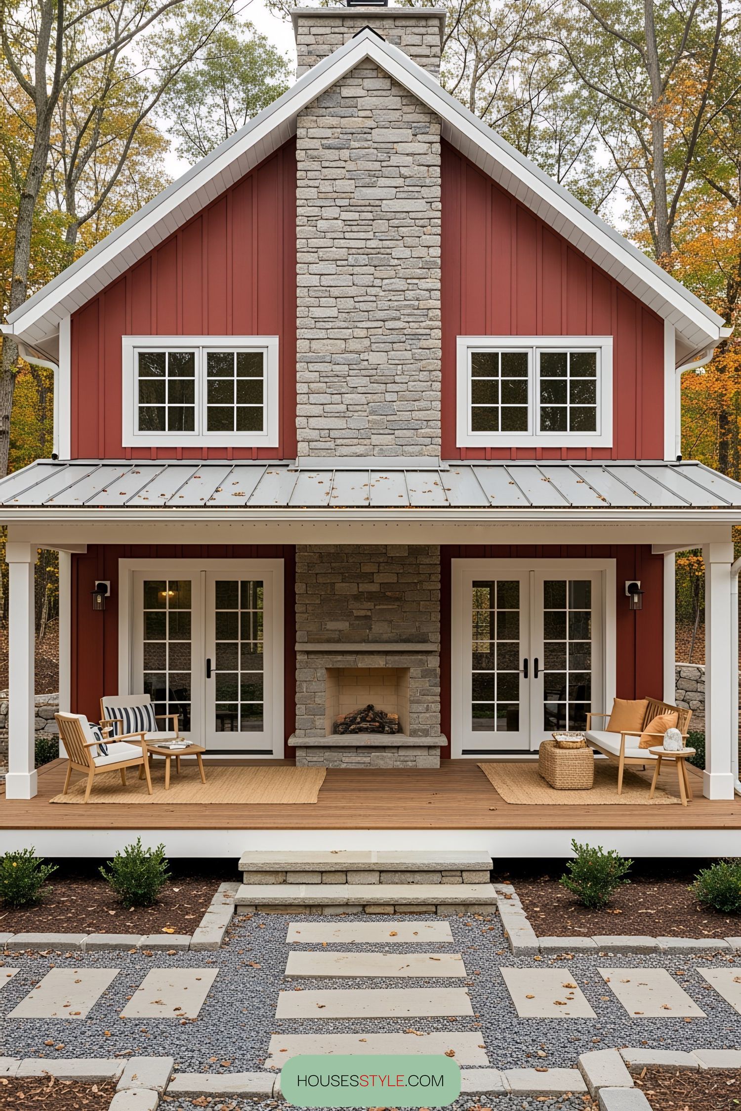 Red cabin with stone chimney and cozy porch