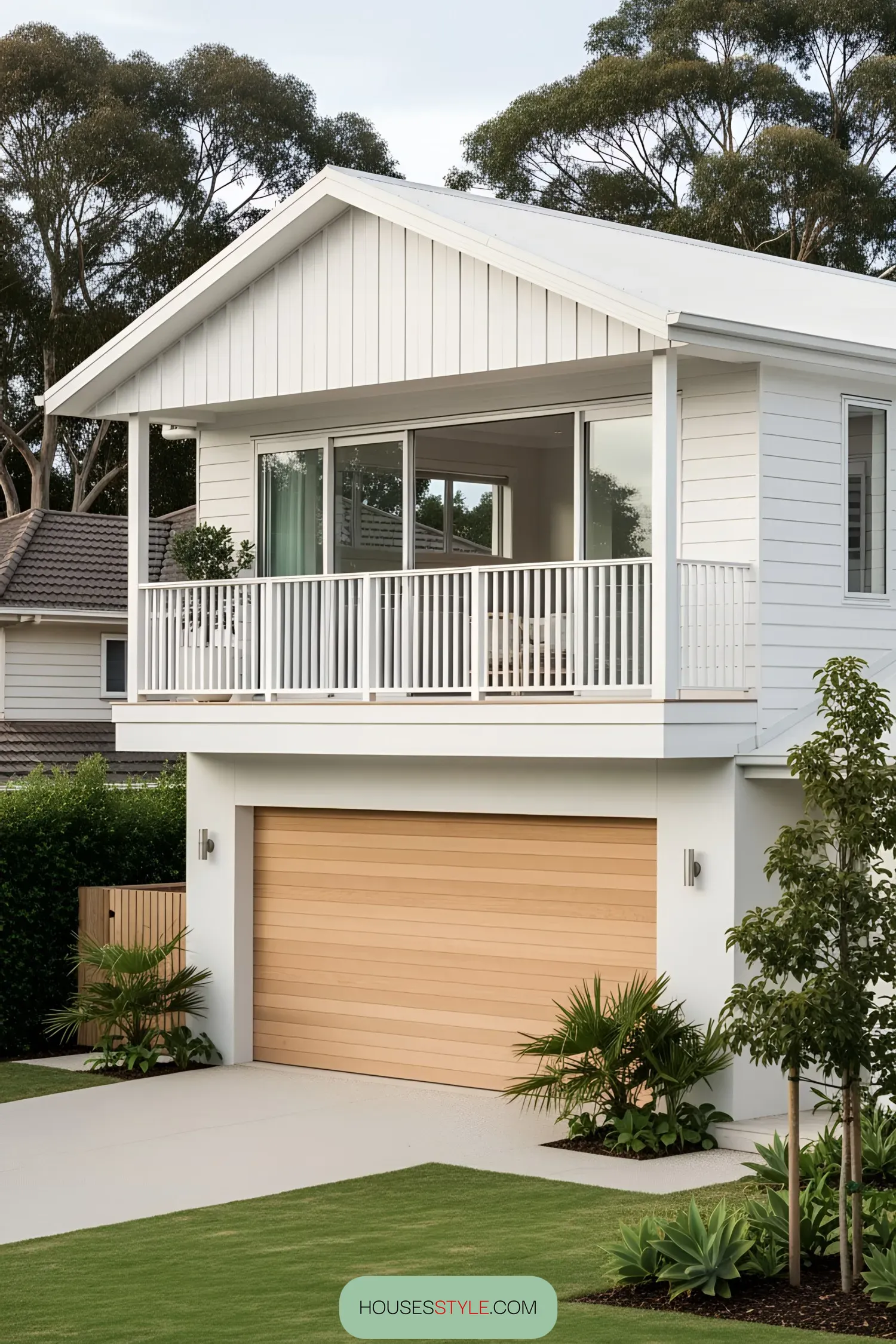 Modern coastal home with white siding and wooden accents
