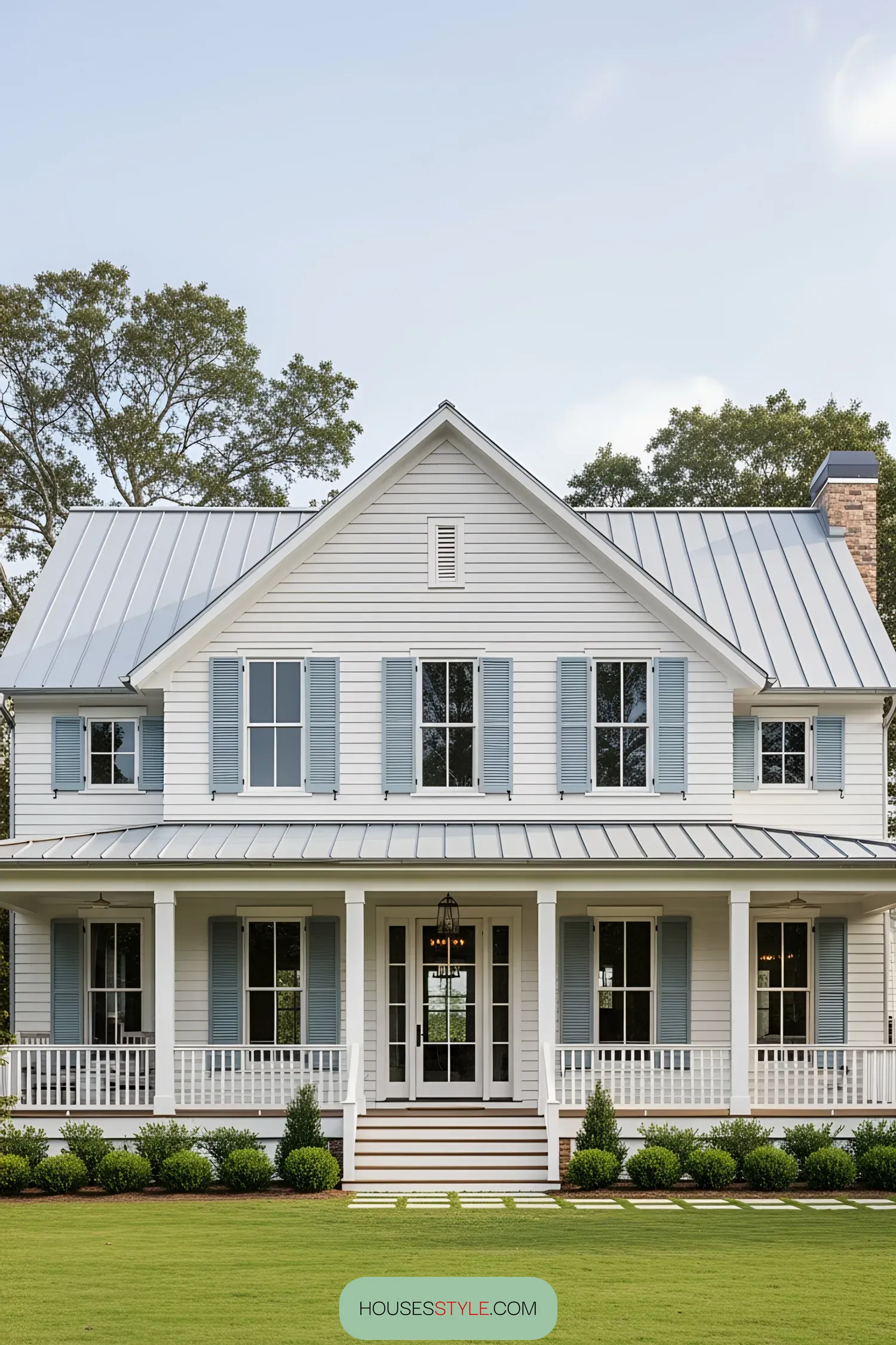 Charming coastal house with blue shutters and wide porch