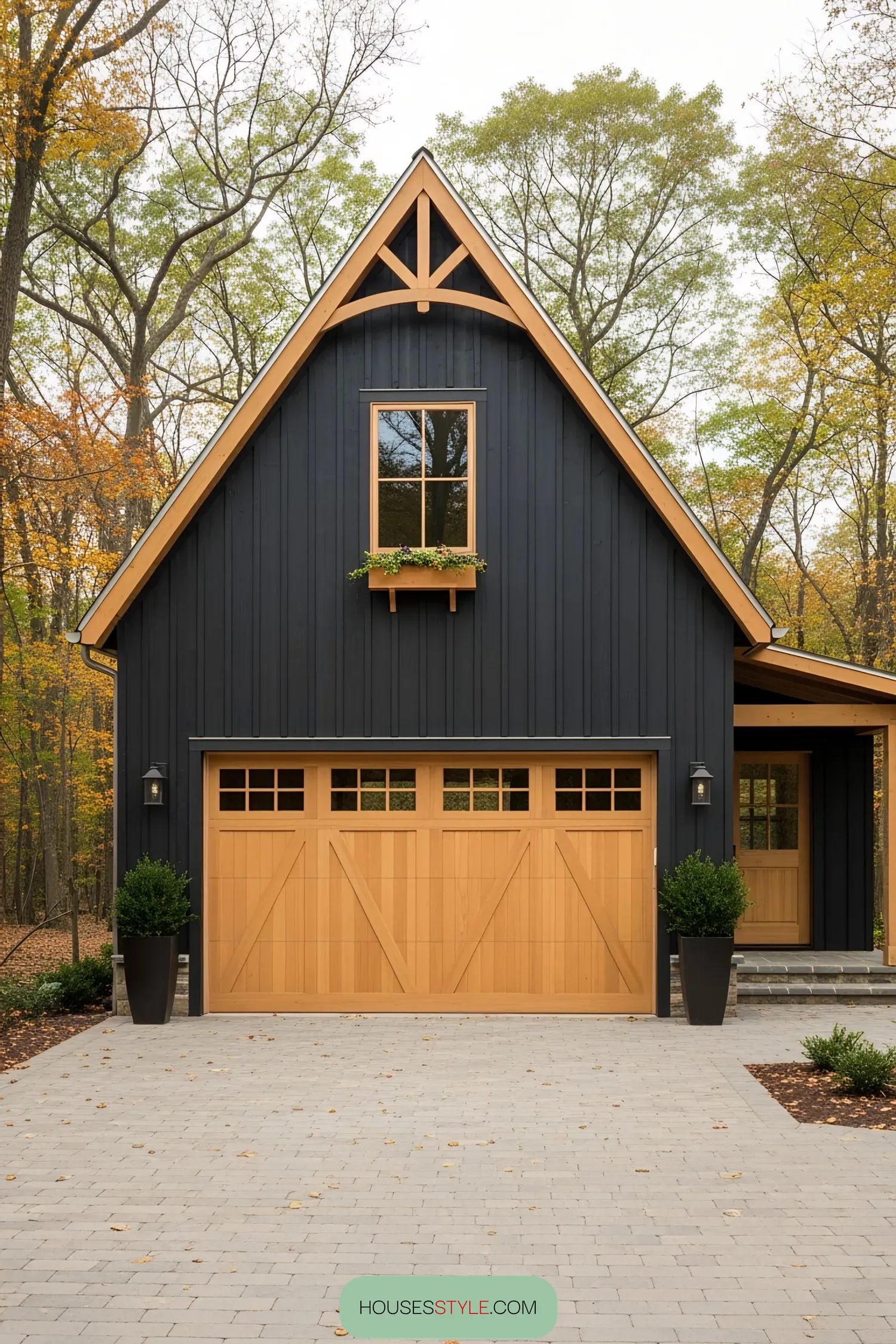 Farmhouse with wooden garage doors