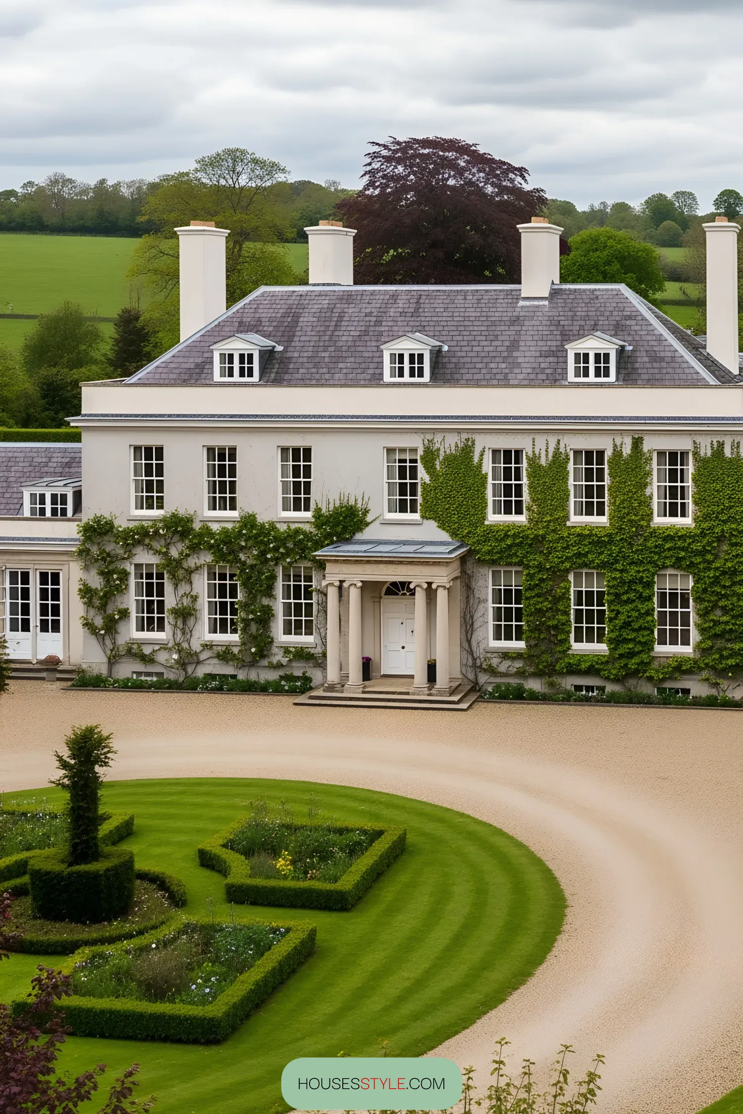 Grand manor house with ivy-clad facade and manicured gardens