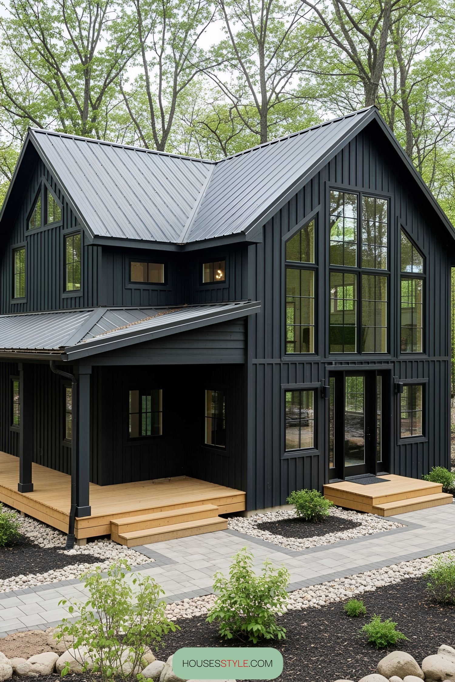 Black barn house with modern design surrounded by trees