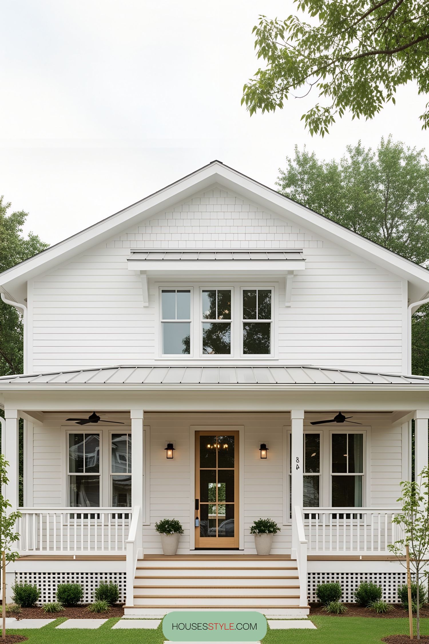 White bungalow with a cozy porch and charming simplicity