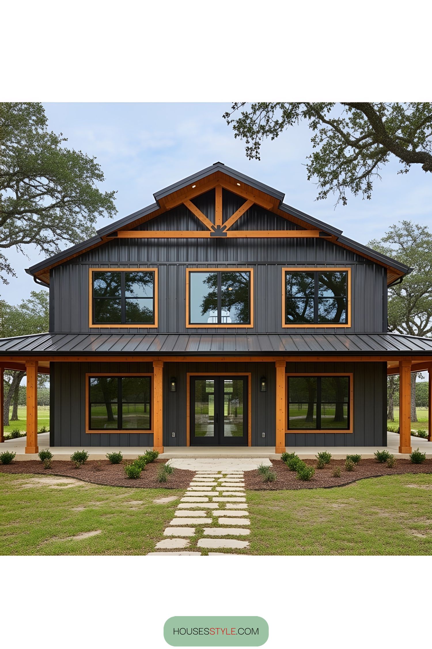 Modern barn-style house with a wraparound porch
