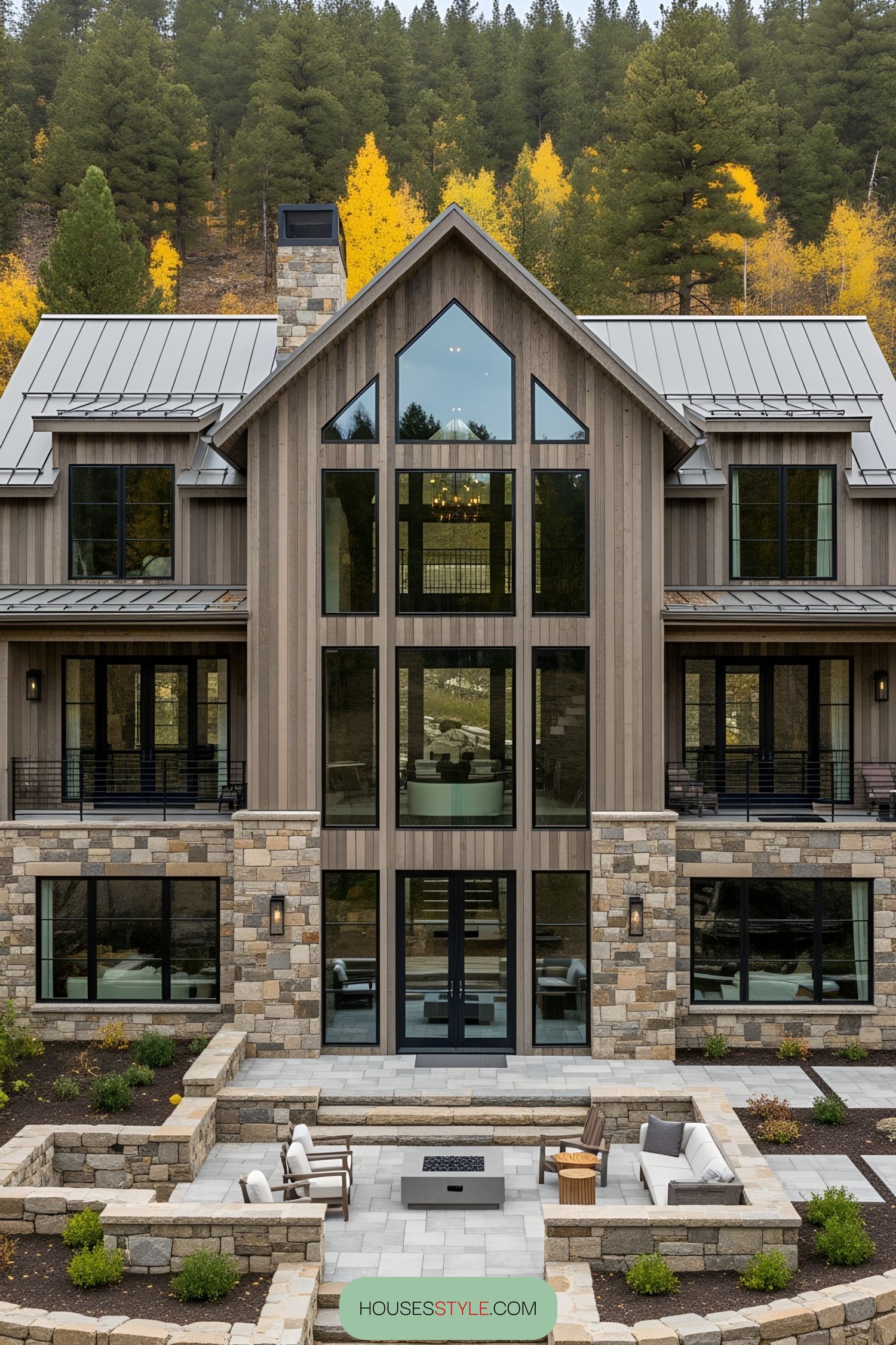 Modern rustic house with stone and wood facade surrounded by trees