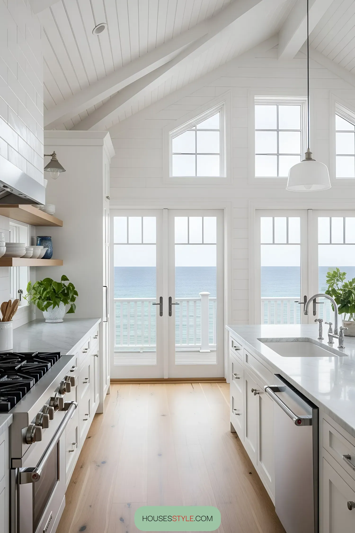 Bright kitchen overlooking the ocean with large windows and a beautiful interior