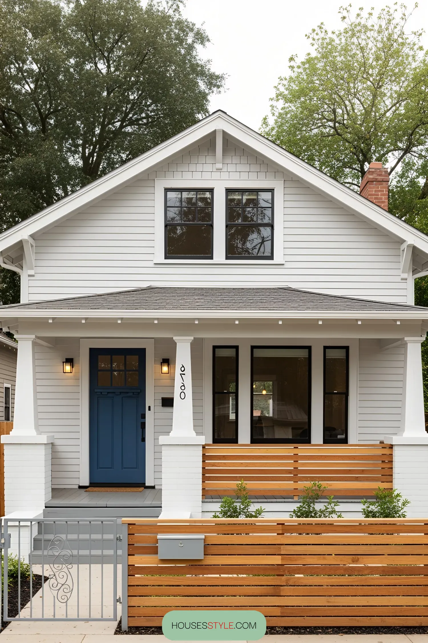 Charming 1930s bungalow with white facade and blue door