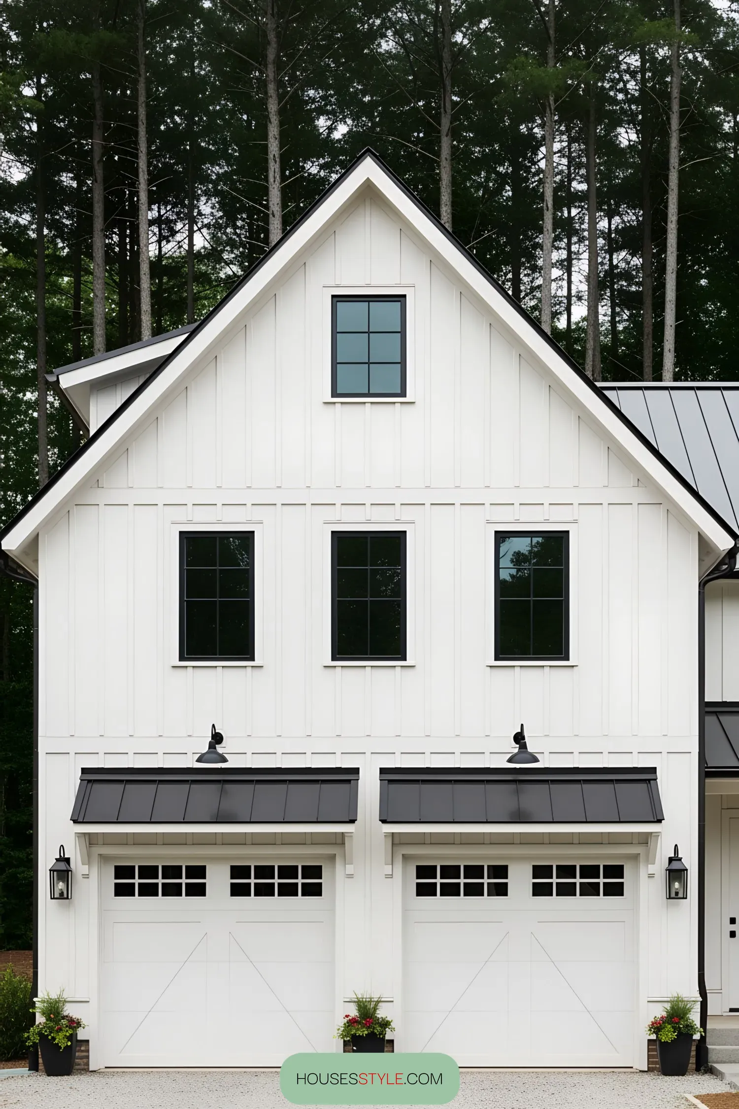 White farmhouse with double garage and black accents