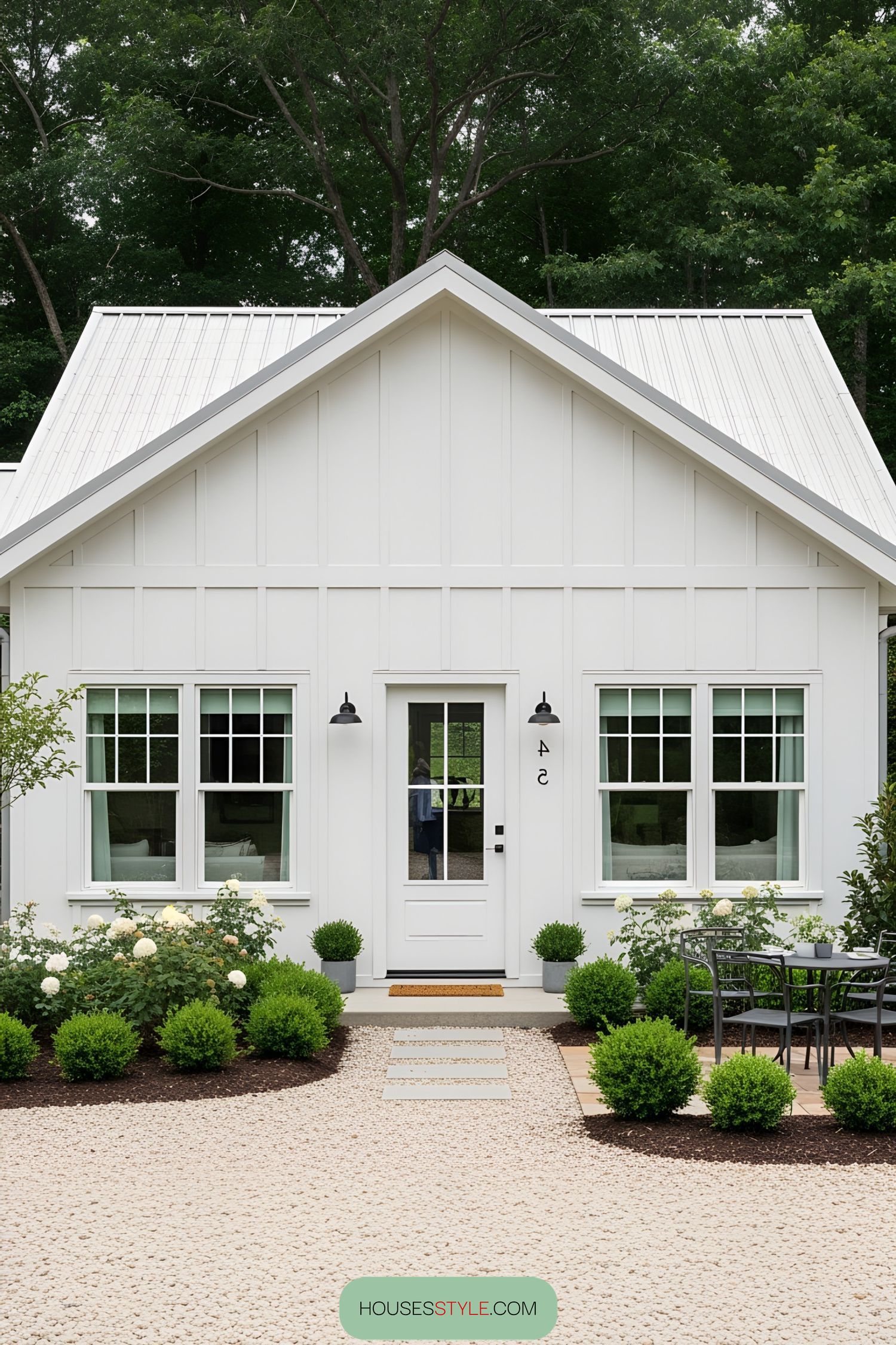 Charming white bungalow with lush greenery