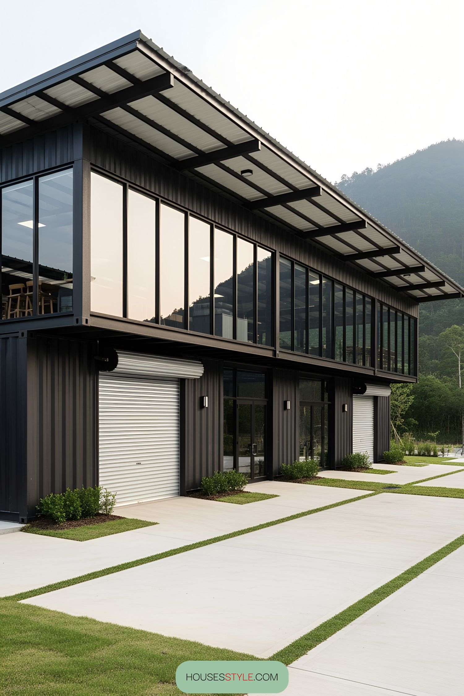 Modern shipping container workshop with glass walls