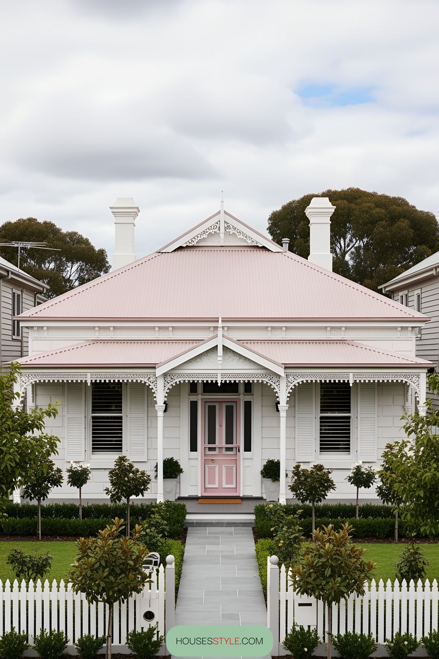 Charming pink Victorian house with ornate details