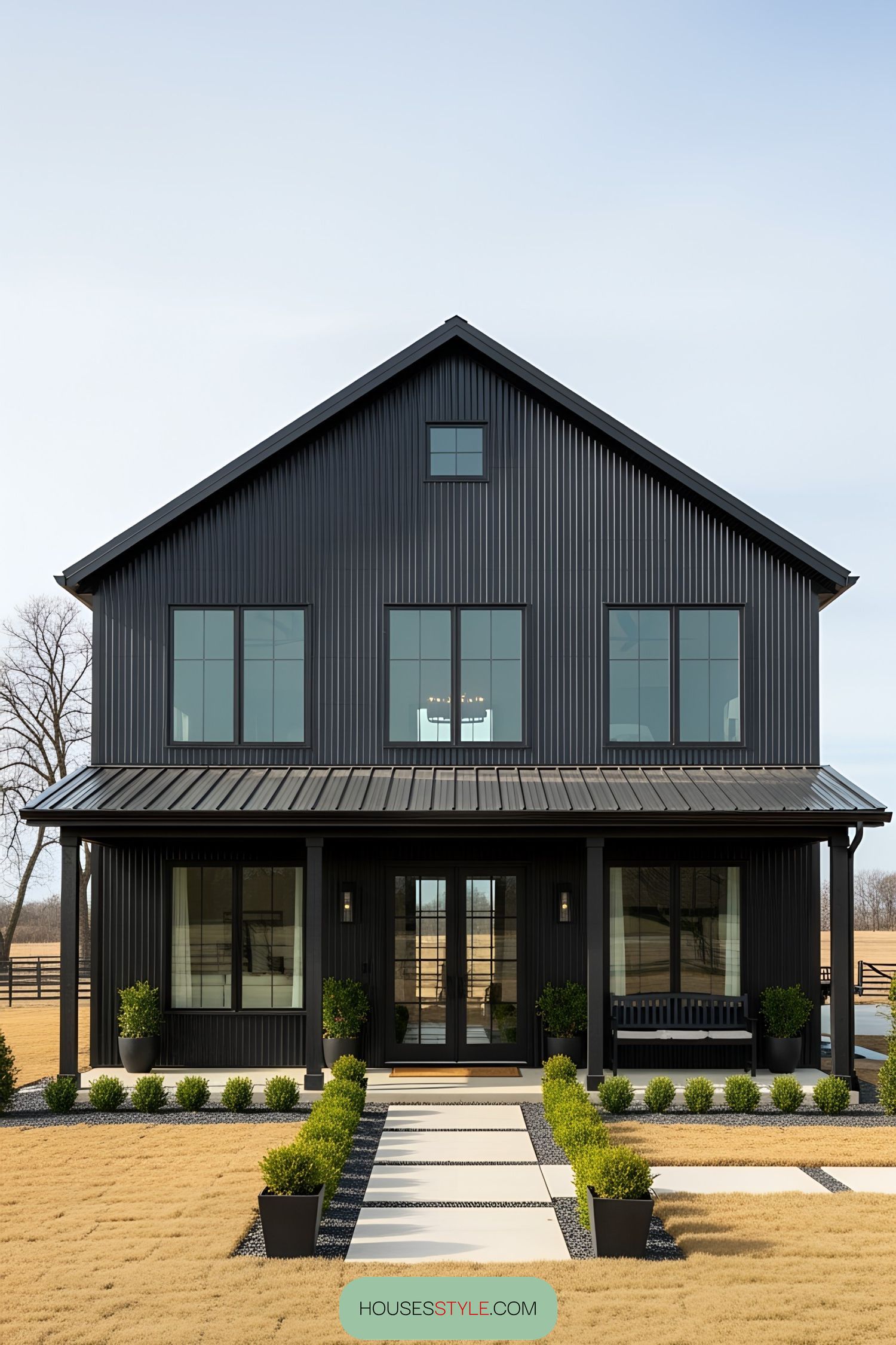 Black barn house with modern design and large windows