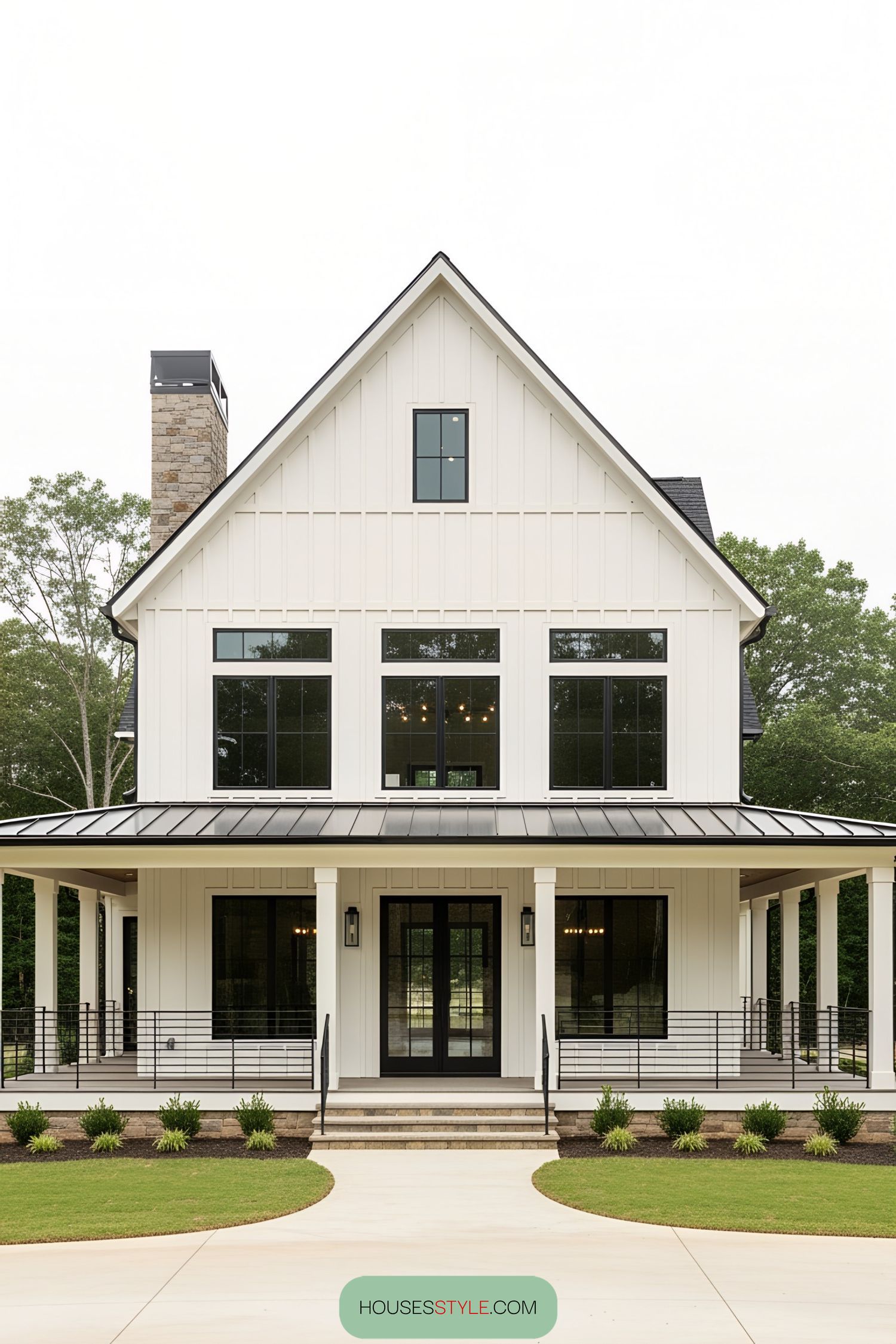 Sleek barn-style home with expansive porch