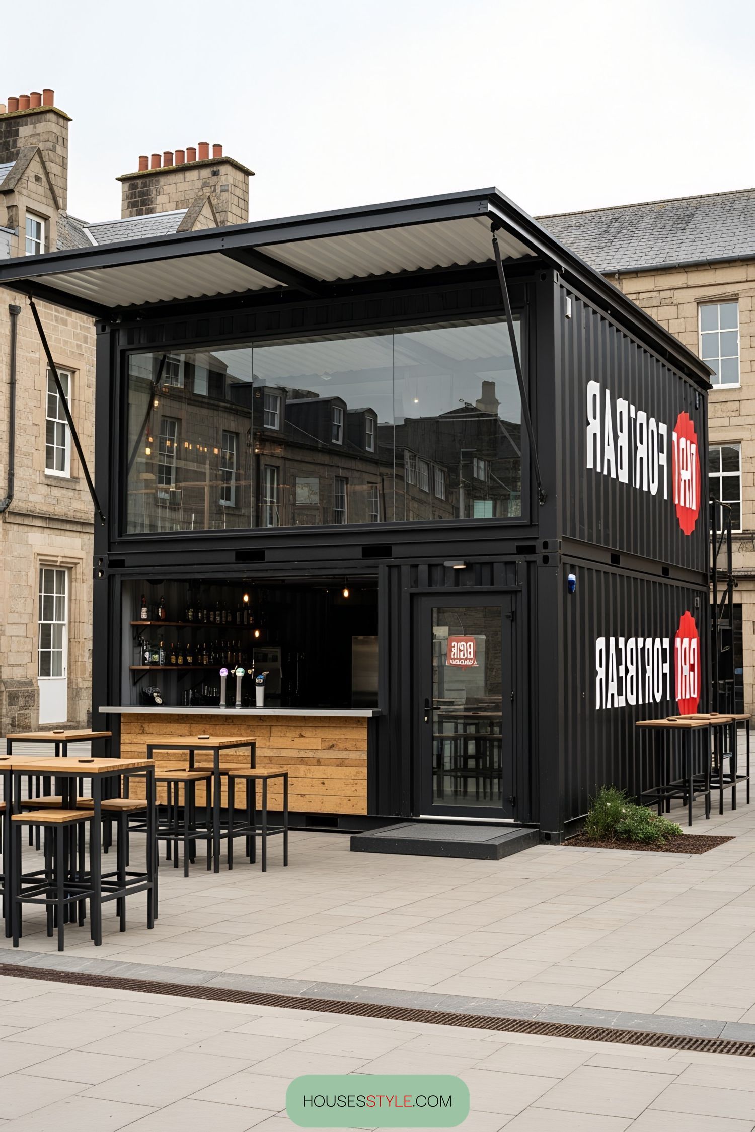 Trendy black container bar with outdoor seating