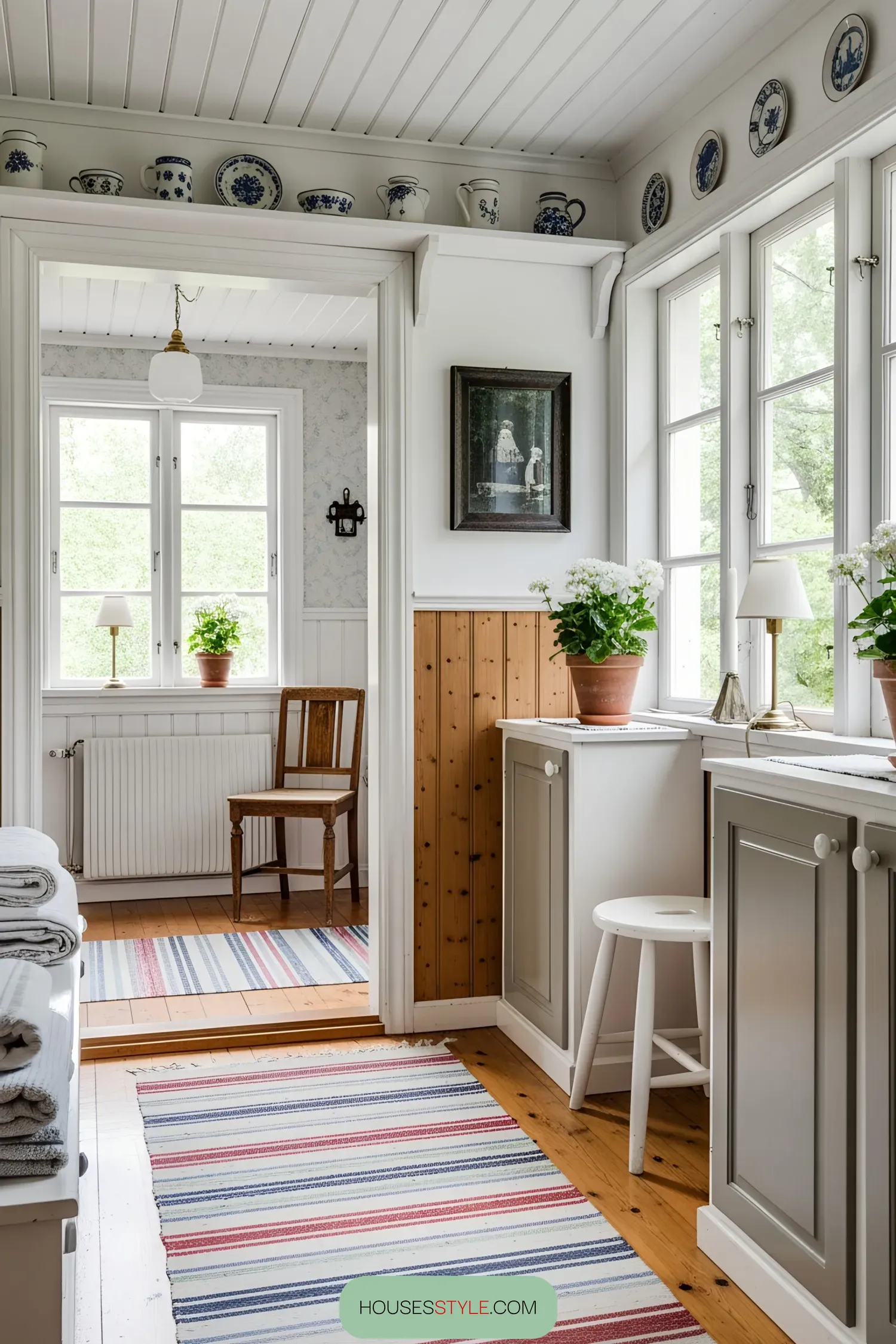 Bright Swedish interior with rustic details and striped rugs