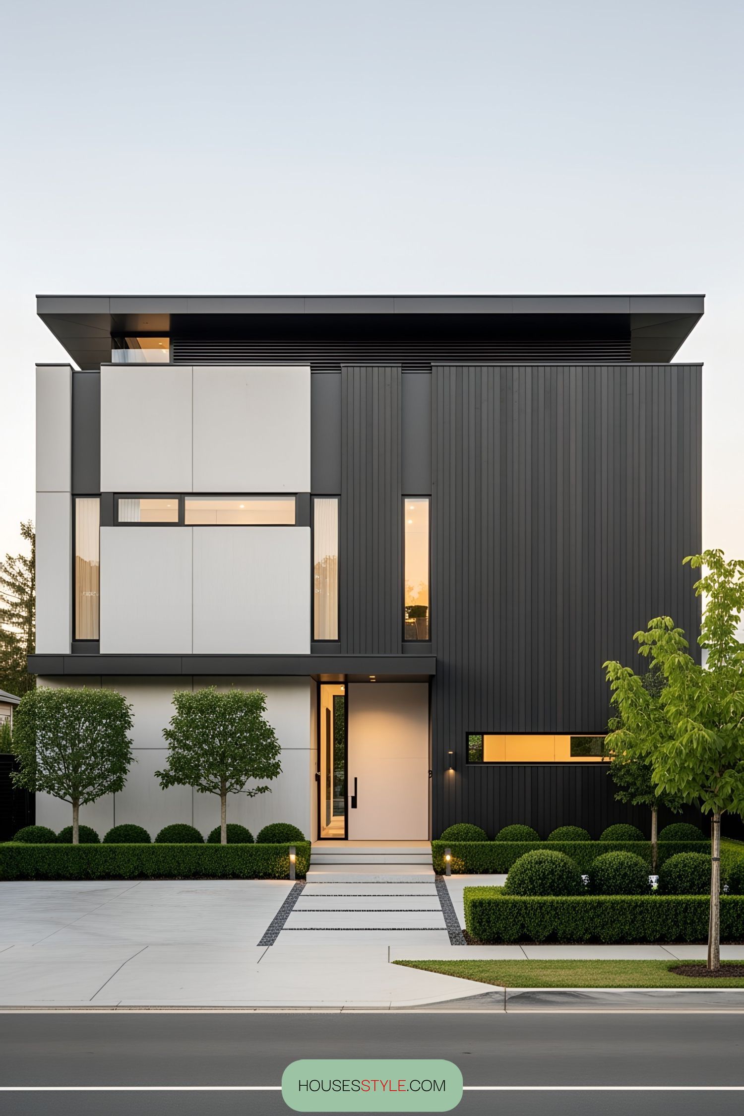 Sleek modern villa with geometric design and lush landscaping