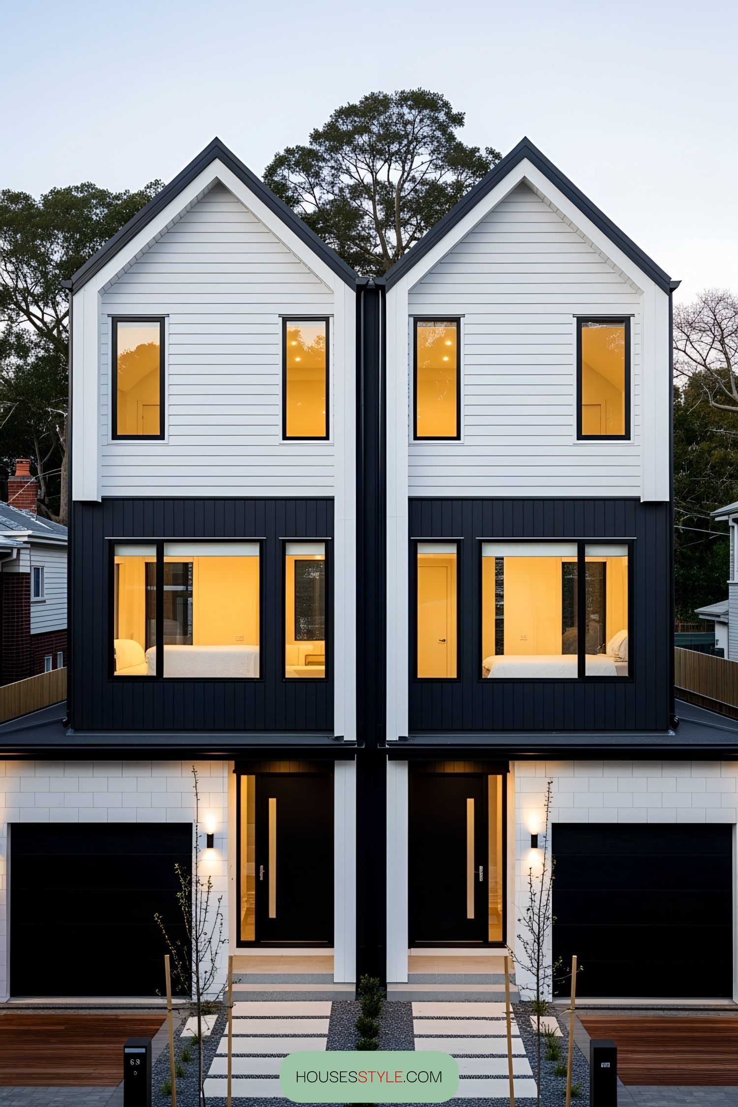 Contemporary duplex with contrasting colors and lit interiors