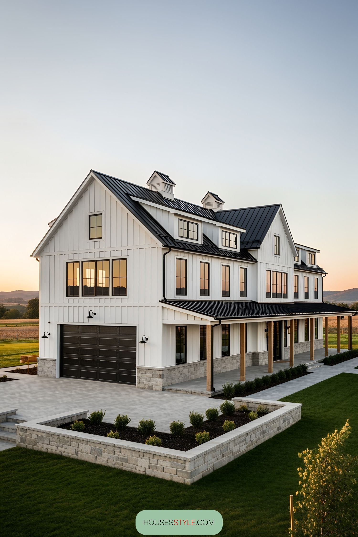 White barn-style house with black roof and windows