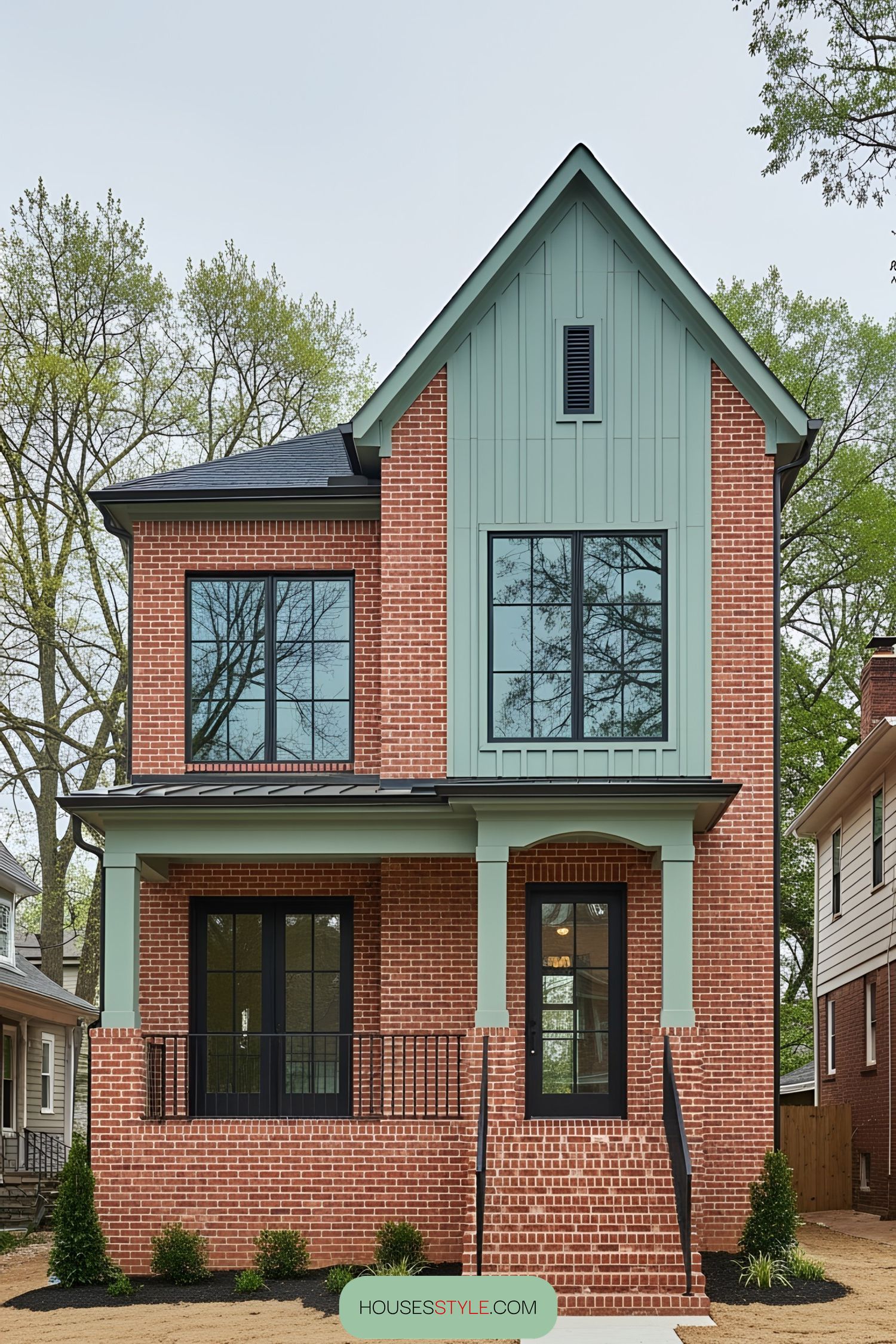 Two-story brick house with green accents