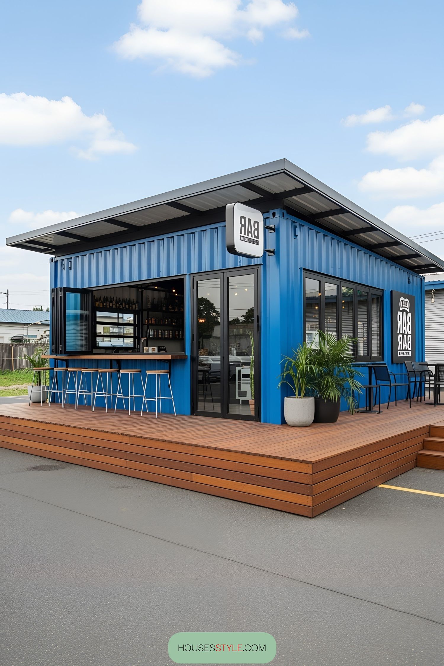 Blue container bar with a wooden deck