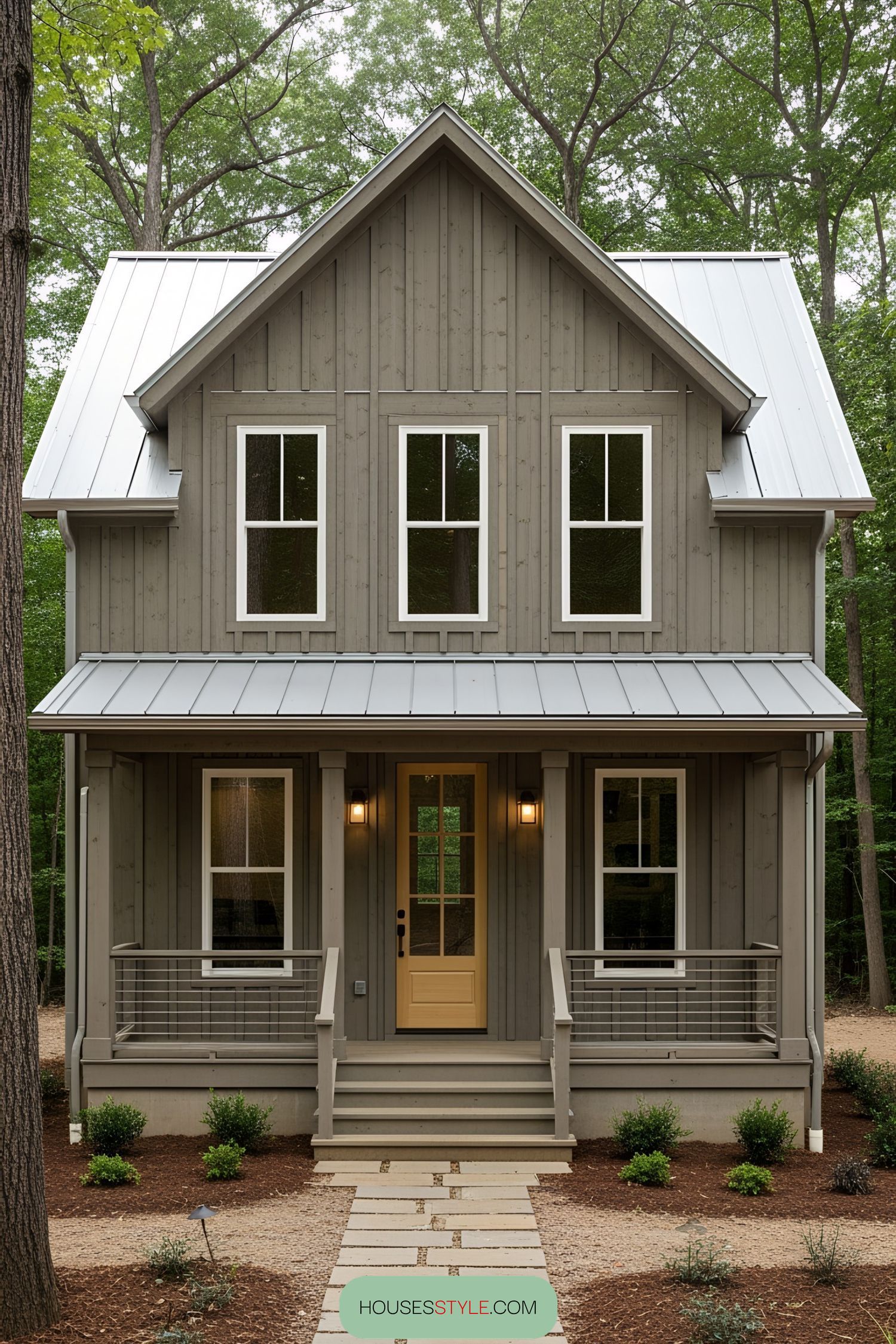 Charming rustic house with gray siding and a cozy porch