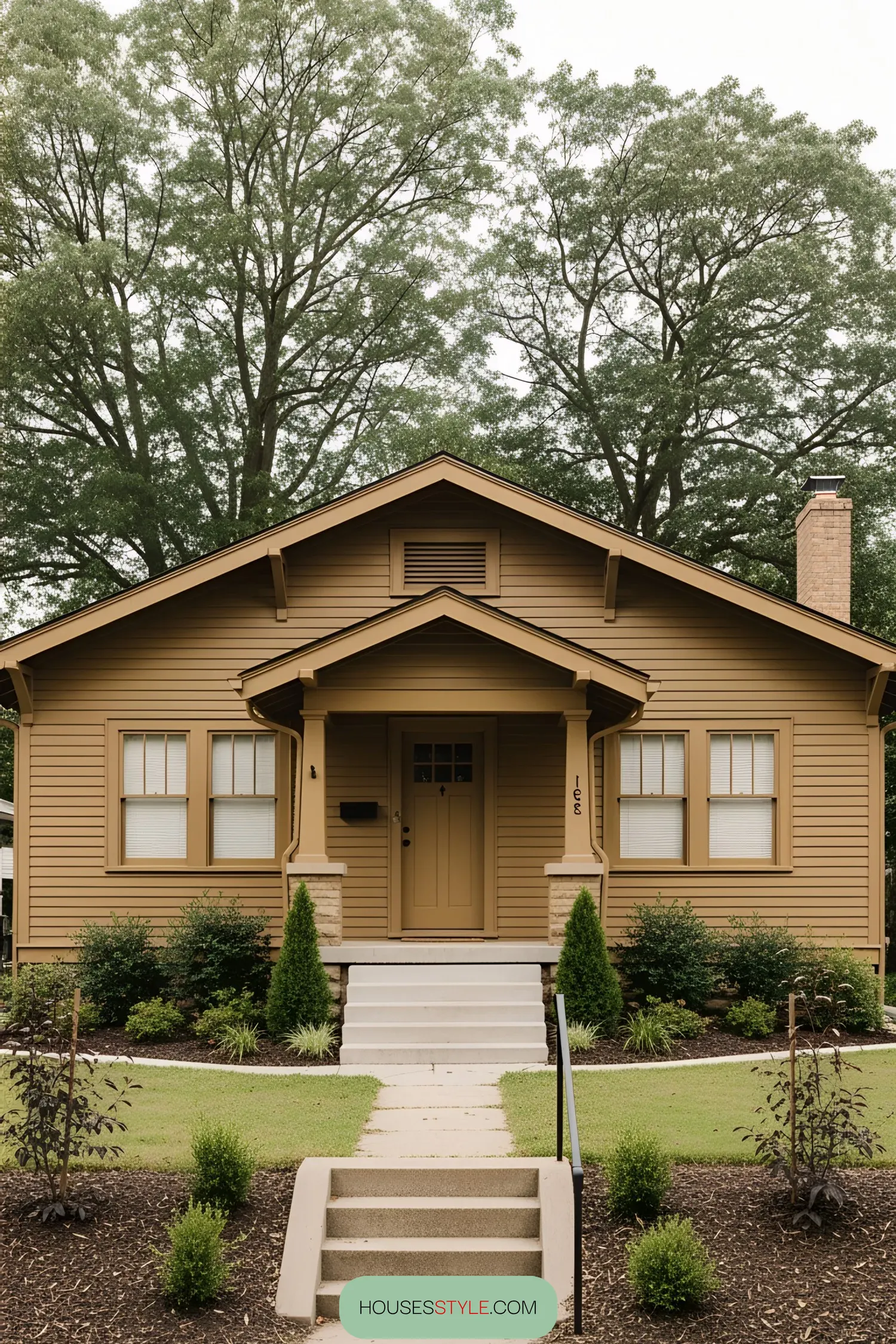 Classic yellow bungalow with lush greenery