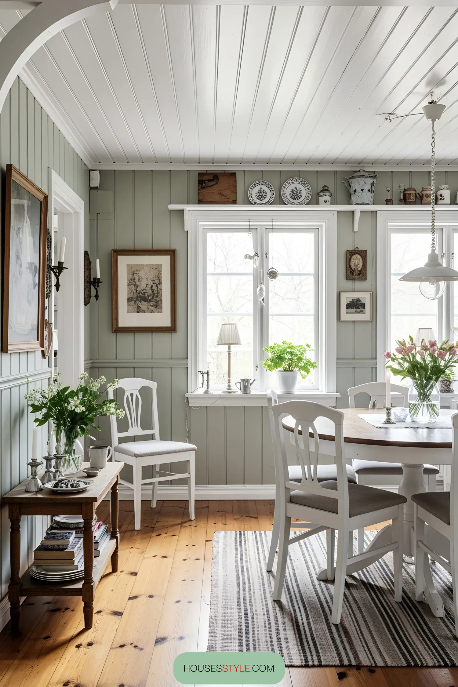 Cozy dining room with wooden floors and white furniture