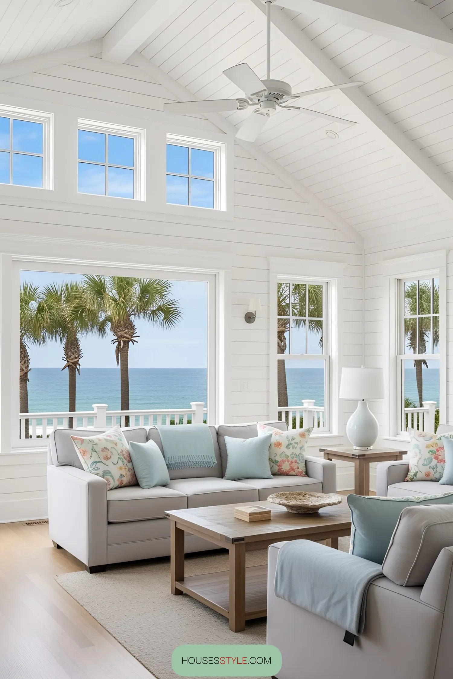 Bright beach house living room with ocean view