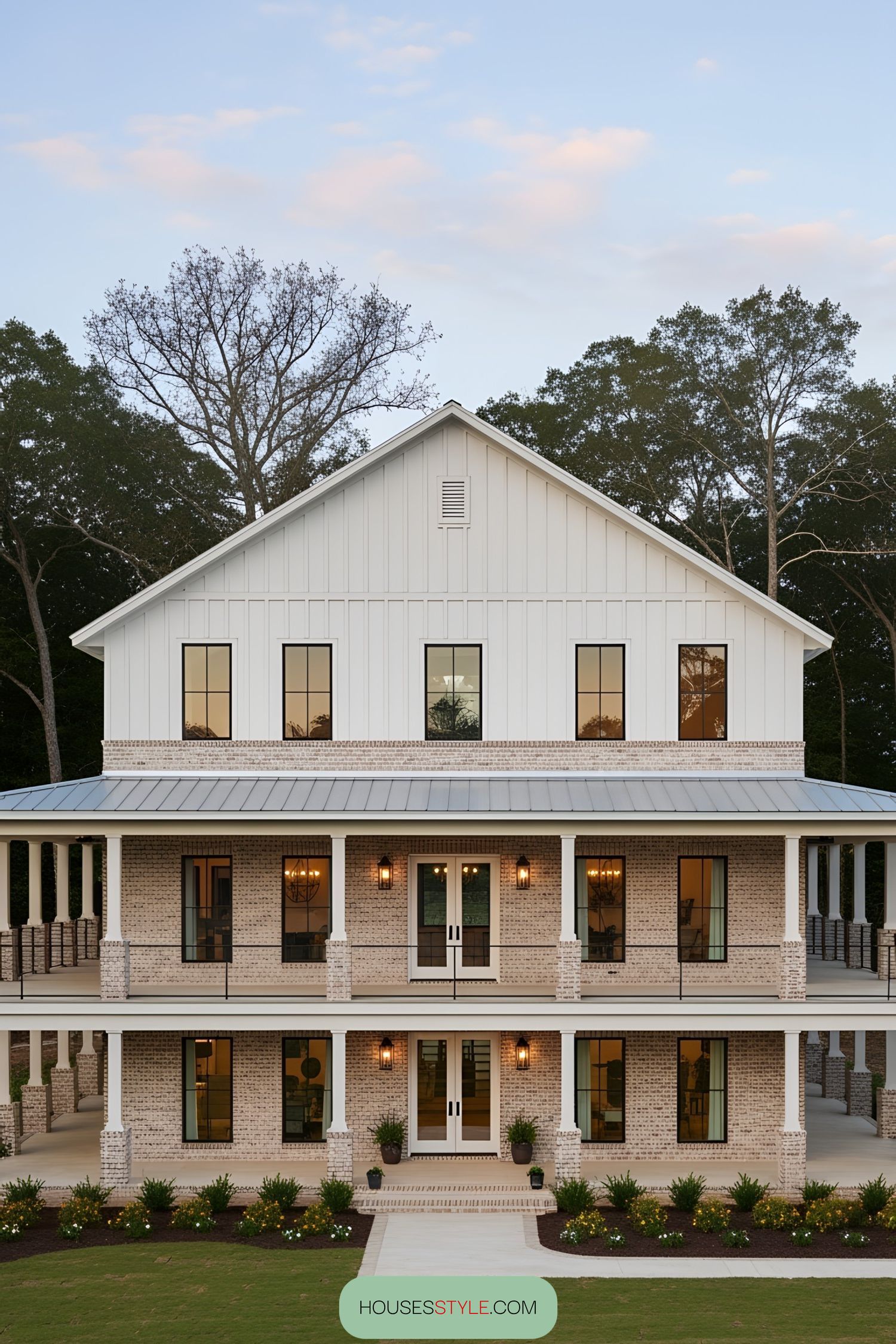 Two-story barndominium with wraparound porch