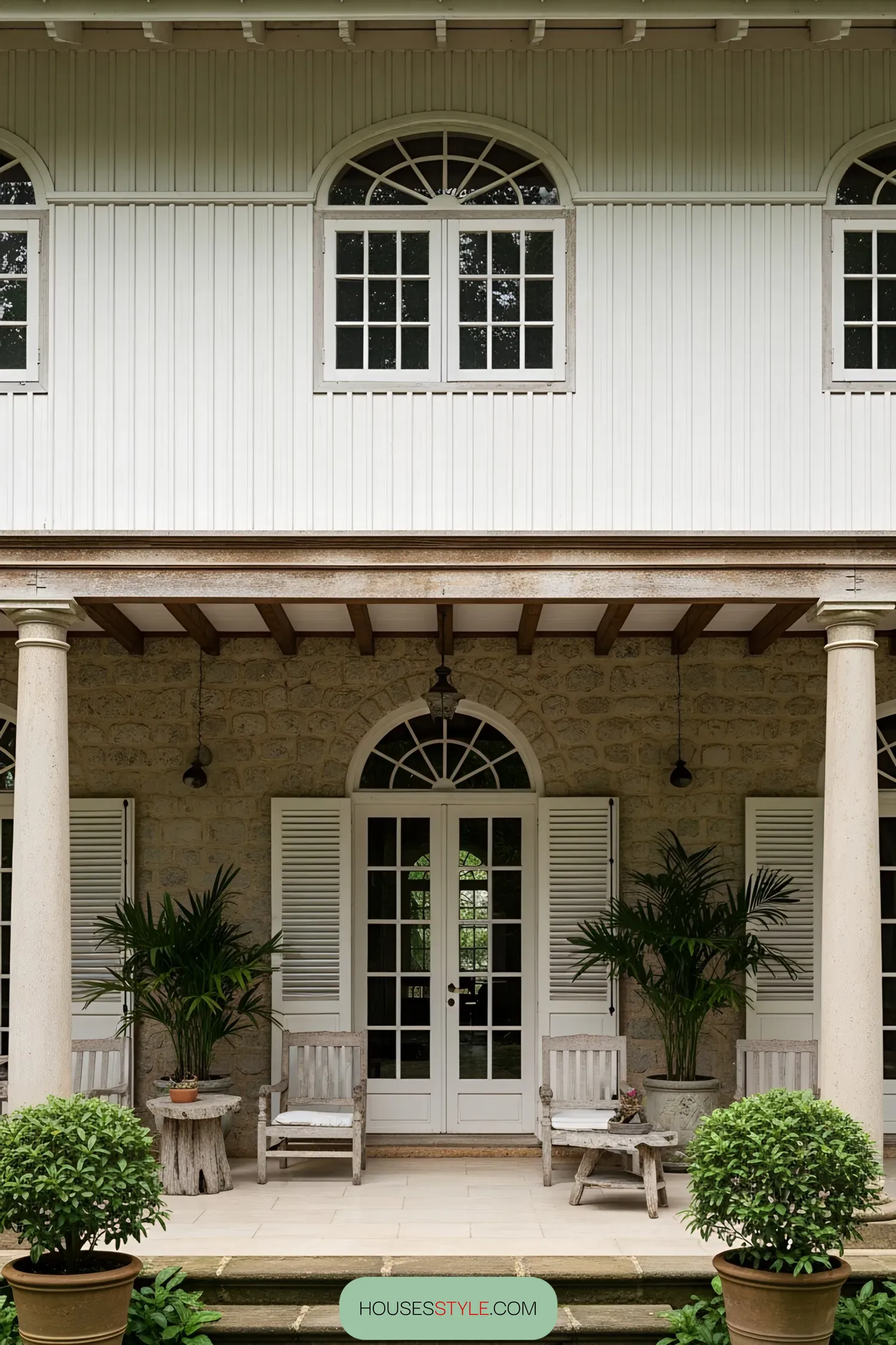 Colonial-style house with veranda and garden