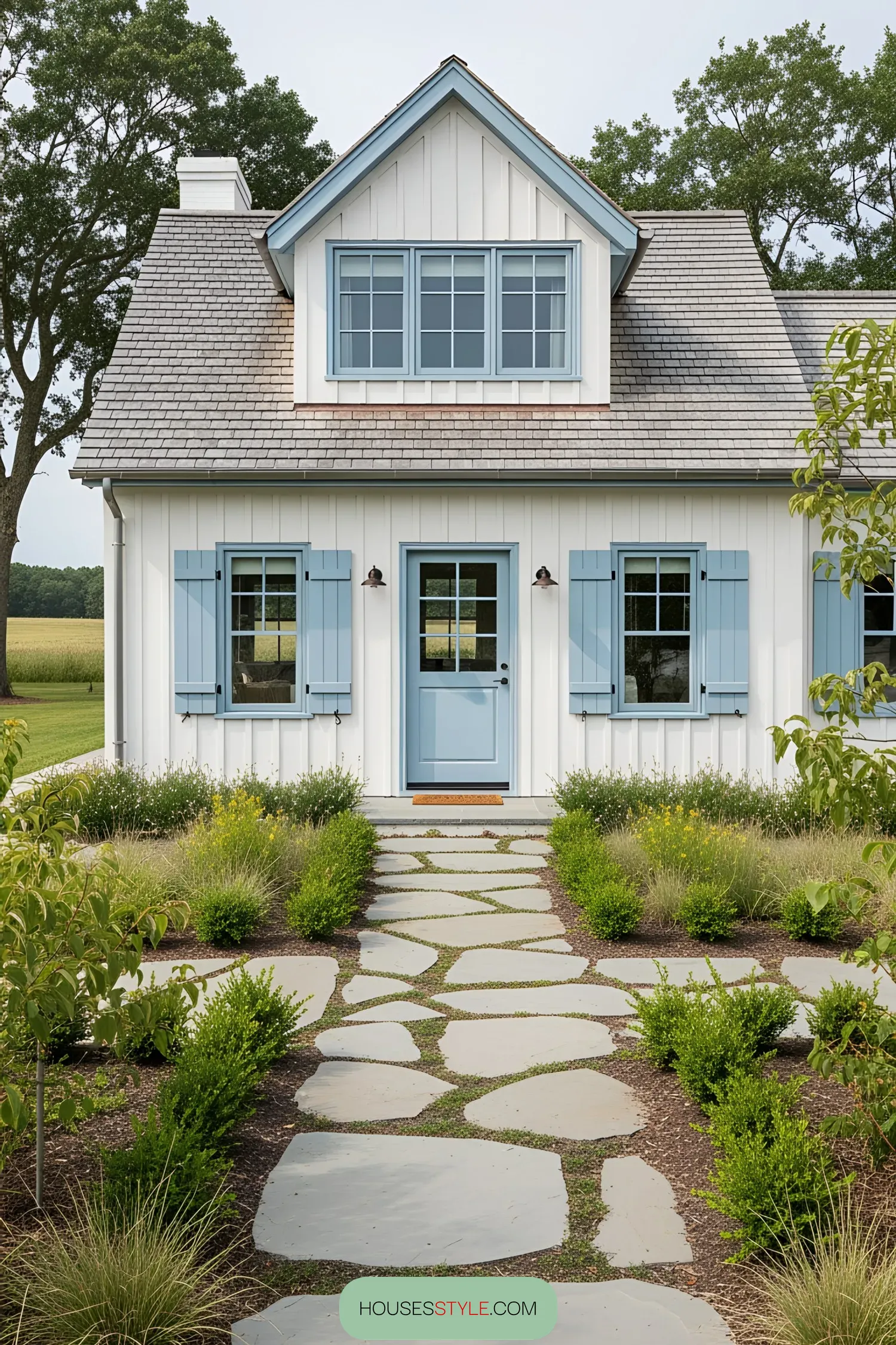 Coastal house with blue shutters and stone pathway