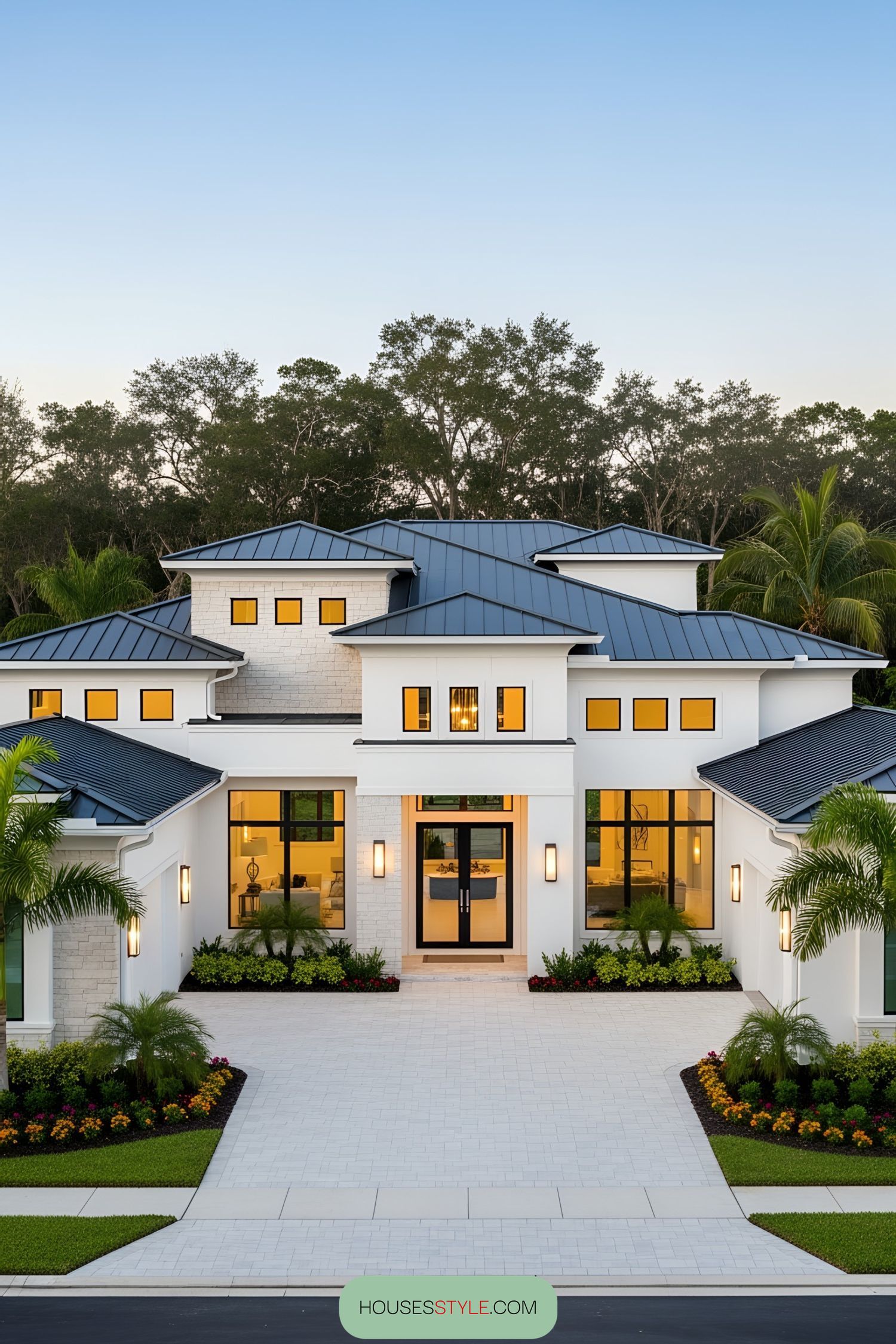 Luxurious white house with large windows and a sleek roof